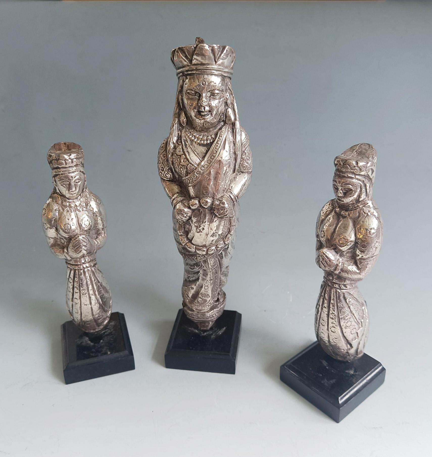 Antique Indian Silver-Clad Votive Figures – Set of 3  19th Century  Rajasthan or Gujarat
A Rare Set of Three Antique Indian Silver-Clad Wooden Votive Figures

Western India, Likely Rajasthan or Gujarat  Early to Mid-19th Century
Hand-Carved Wood