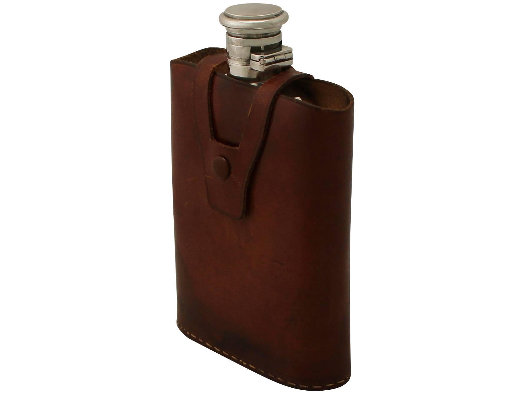 An exceptional, fine and impressive antique Indian 900 standard silver hip flask with the original leather case; part of our wine and drinks related silverware collection.

This exceptional antique Indian 900 standard silver hip flask has an oval