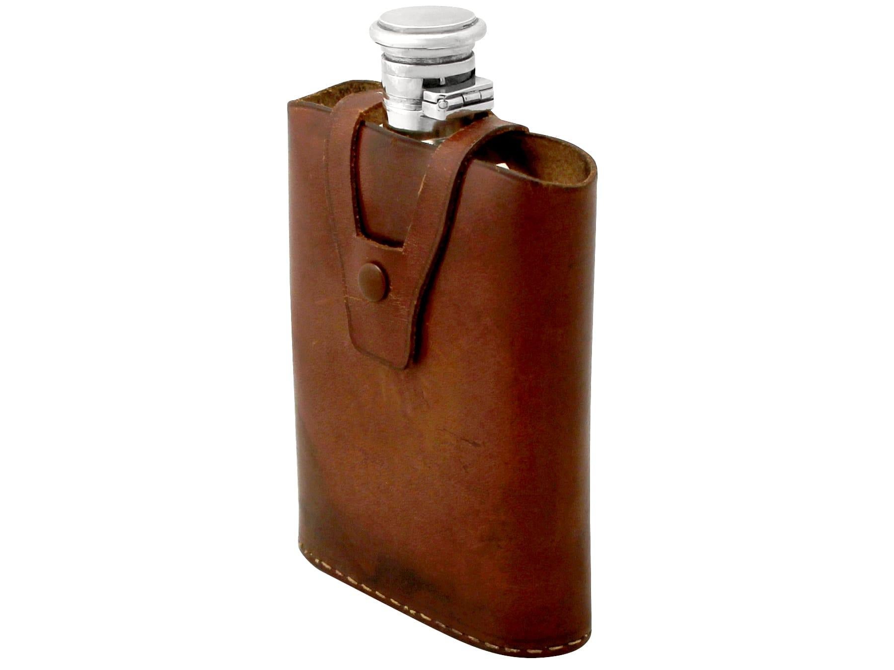 An exceptional, fine and impressive antique Indian 900 standard silver hip flask with the original leather case; part of our wine and drinks related silverware collection.

This exceptional antique Indian 900 standard silver hip flask has an oval