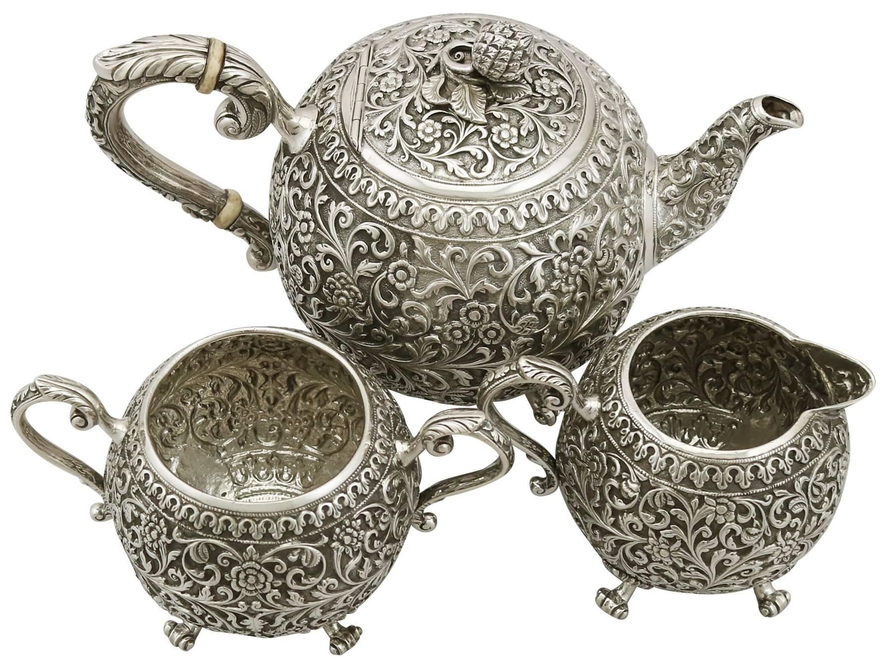 A exceptional, fine and impressive antique Indian silver three-piece tea service made by Oomersee Mawjee & Sons; an addition to our diverse silver teaware collection.

This exceptional antique Indian silver tea set/set consists of a teapot, cream