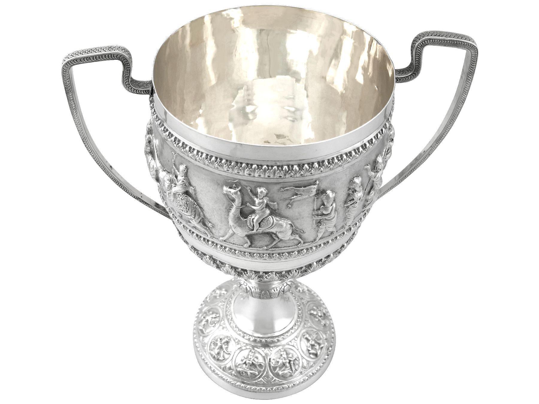 An exceptional, fine and impressive, antique Indian silver trophy/cup; an addition to our Asian silverware collection

This exceptional antique Indian silver trophy has a plain bell shaped form to a knopped circular domed, spreading foot.

The