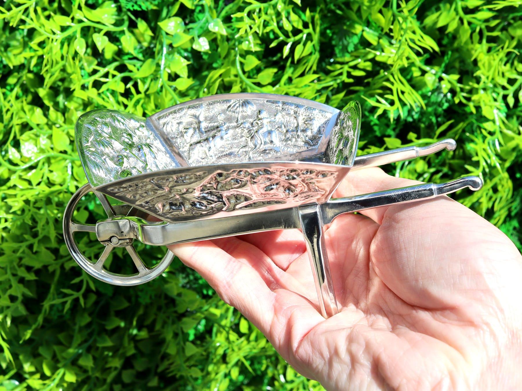 An exceptional, fine and impressive pair of antique Indian silver bon bon dishes in the form of wheelbarrows; an addition to our silver cruet and condiments collection.

These exceptional antique Indian silver dishes have been realistically modelled