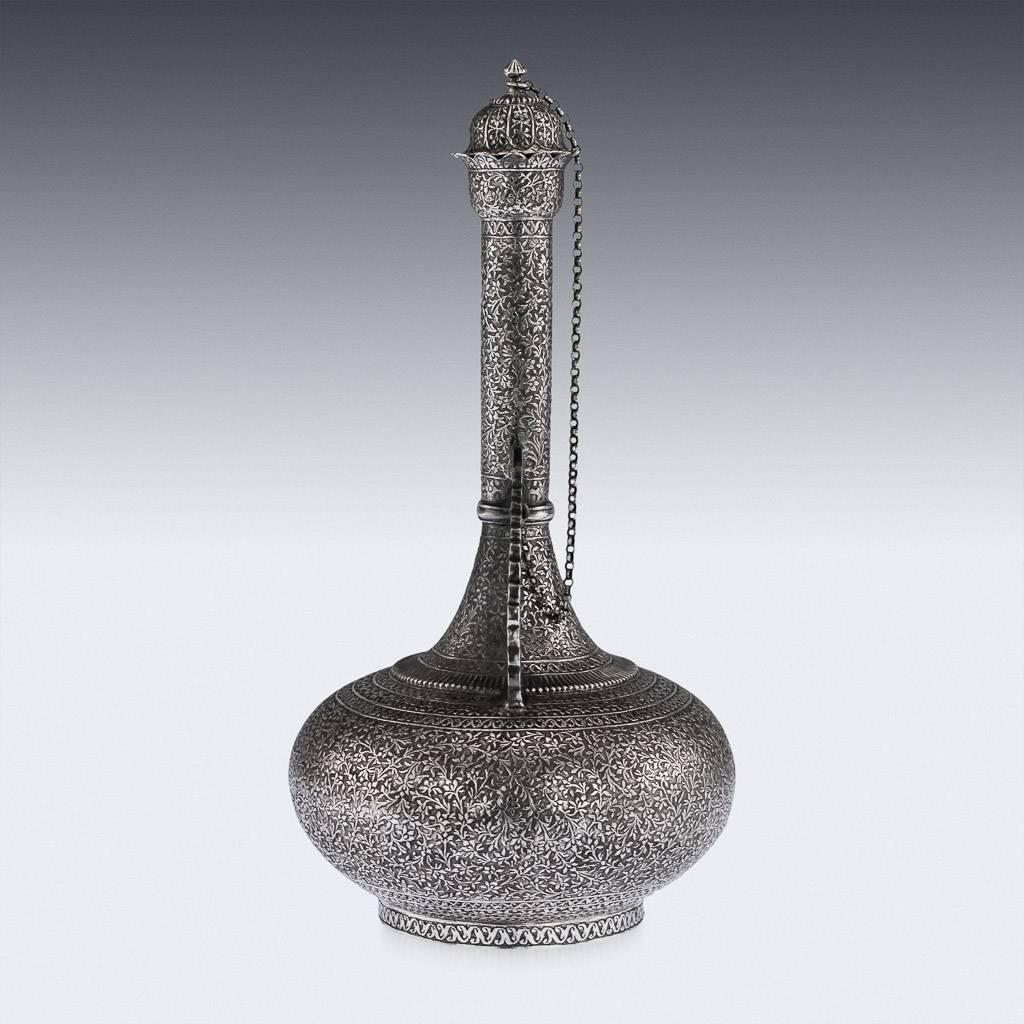 Antique 19th century Indian, Kashmir unusual solid silver (surahi) water bottle, the traditional body shape is profusely and beautifully repousse' decorated throughout with a 'coriander flower pattern', the neck terminating with a lotus shaped rim