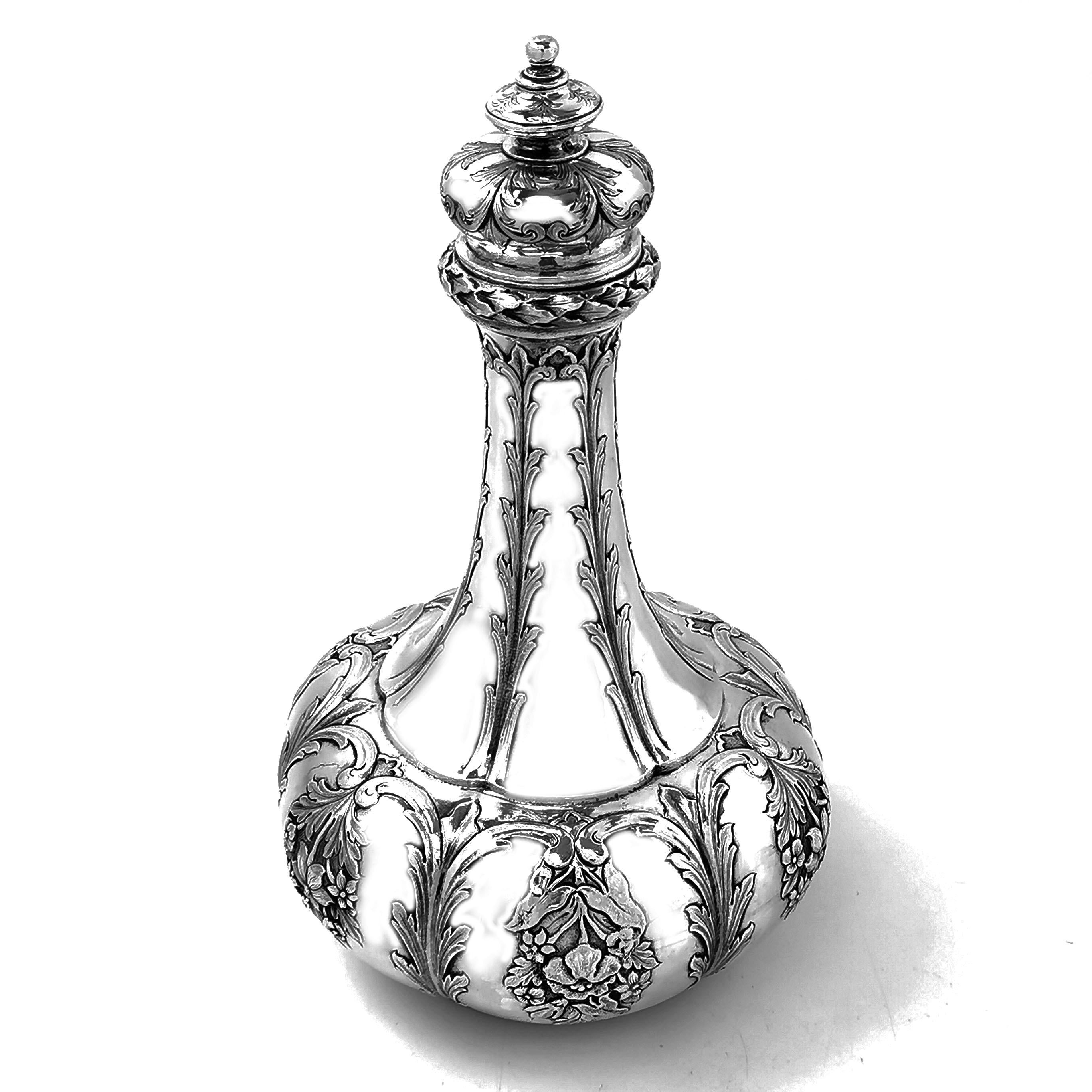 A beautiful Antique Indian Sterling Silver Decanter with a subtle lobed design embellished with delicate floral chased designs. The engraving on the Decanter reads -
Presented to Mess of the Royal Sussex Light Infantry Militia by Major The Honble H.
