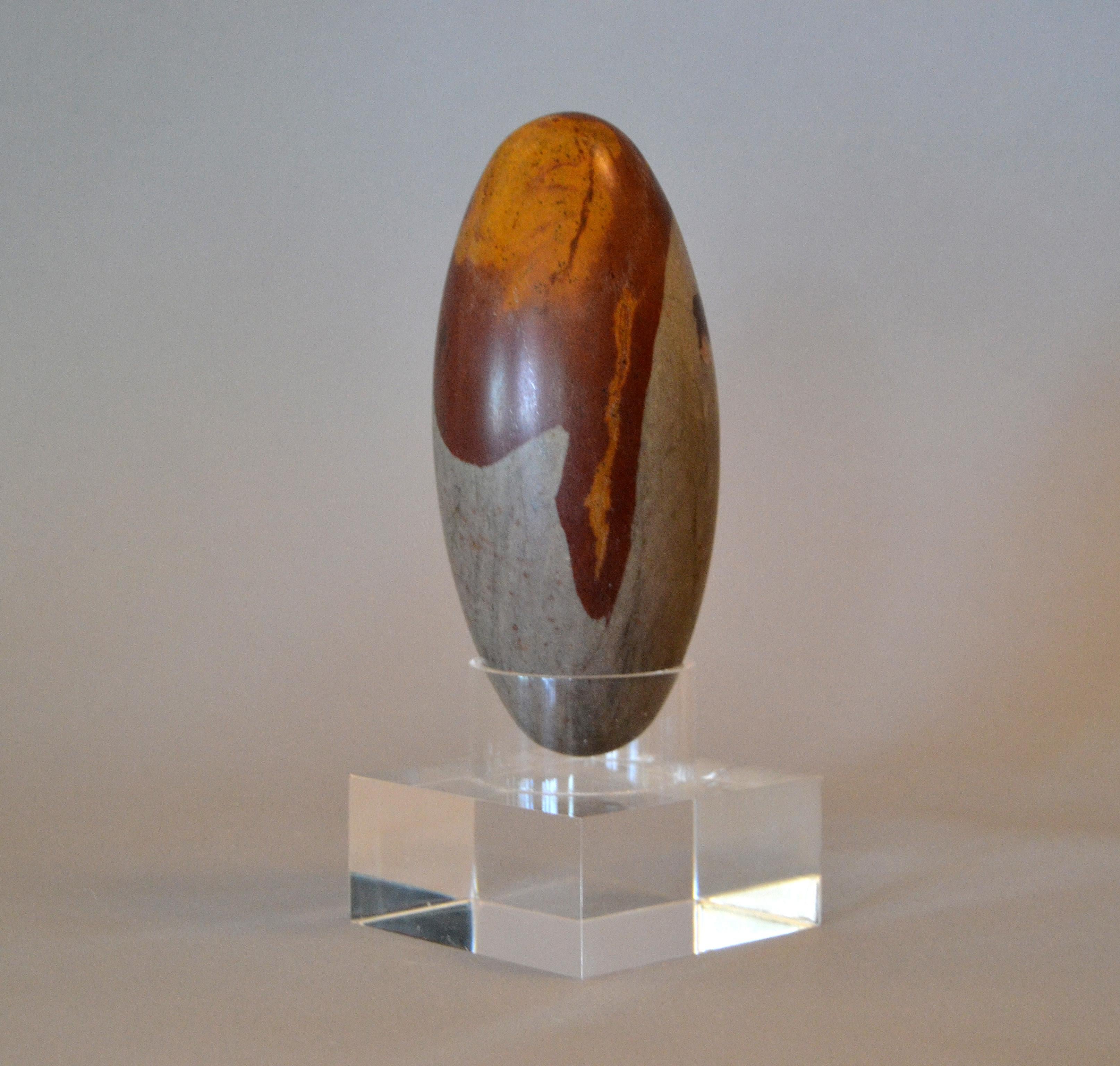 Antique Indian Tantric Shiva Lingam Stone on a clear Lucite stand.
Each stone has a marvelous grain pattern.
Just lovely and a great gift for this holiday season.