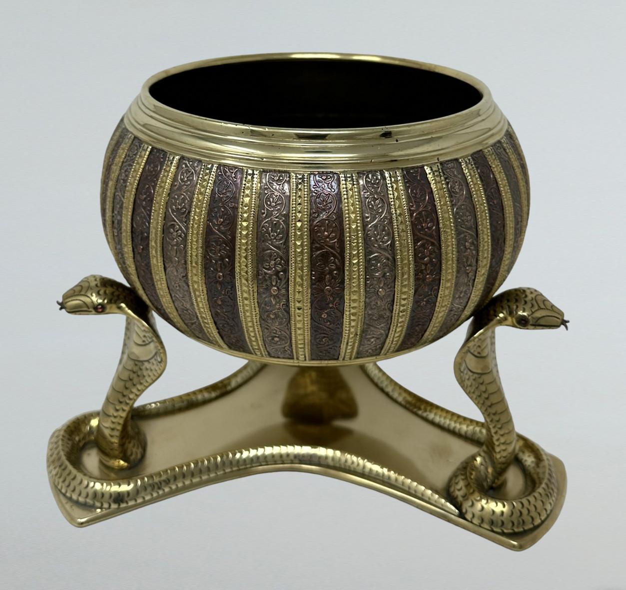 Very Fine Example of an unusually large and heavy gauge Polished Brass and Copper Two Piece Indian Oriental Jardiniere of outstanding quality, late Nineteenth, early Twentieth Century. 

The bulbous decoratively ribbed body in varying shades of