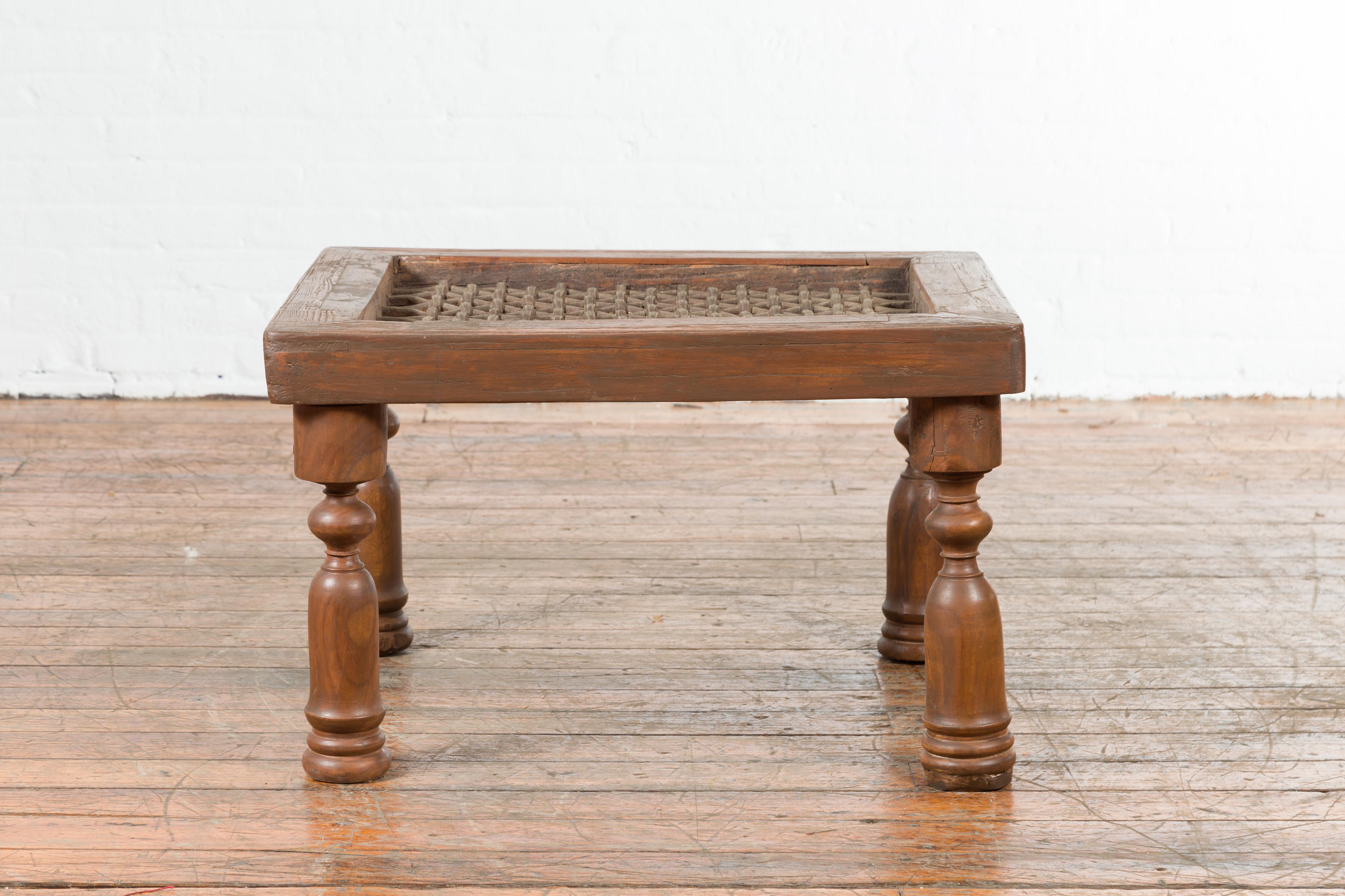 Rustic Antique Indian Window Grate Made into a Coffee Table with Turned Baluster Legs For Sale