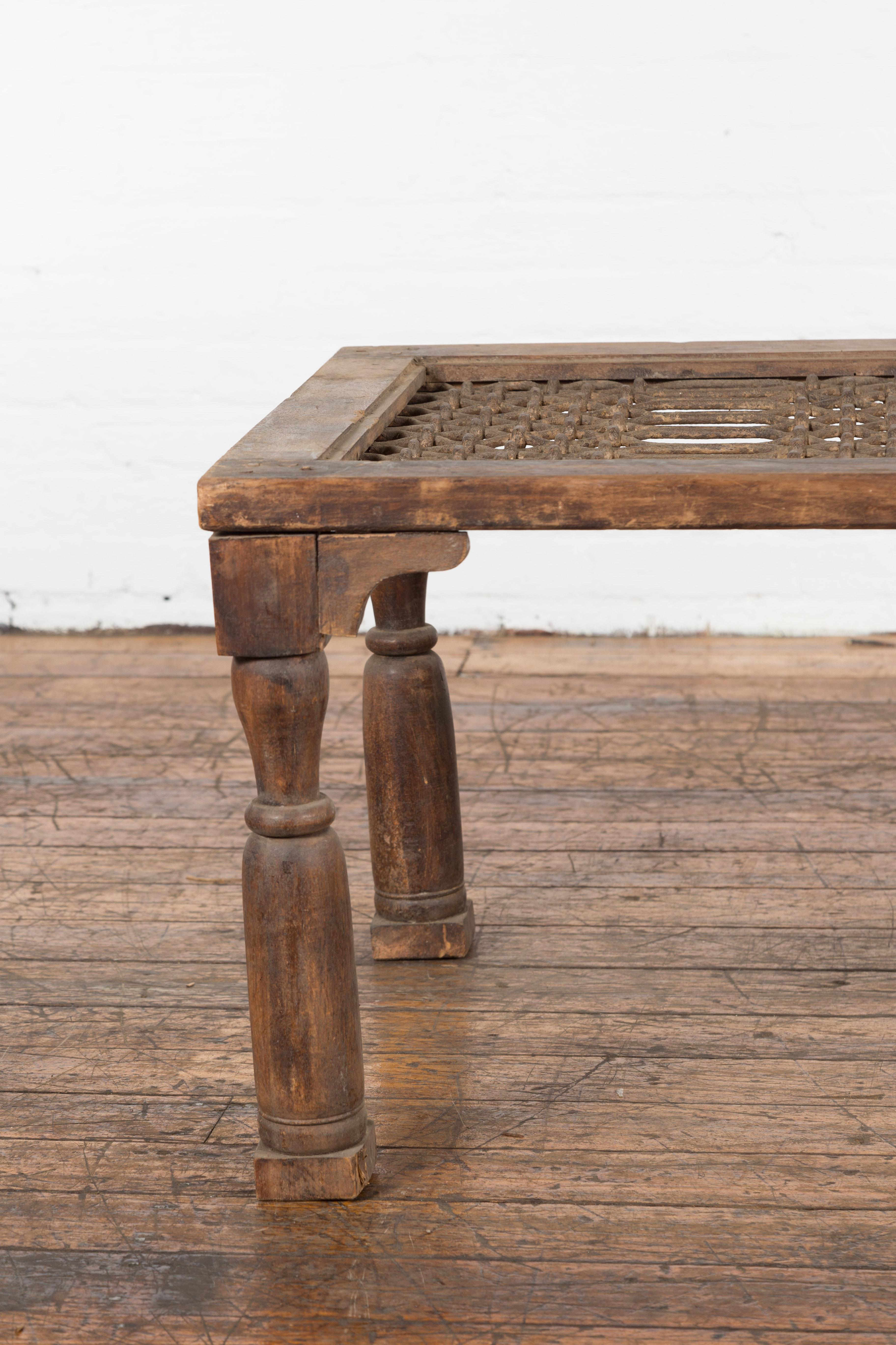Rustic Antique Indian Window Grate Made into a Coffee Table with Turned Baluster Legs For Sale