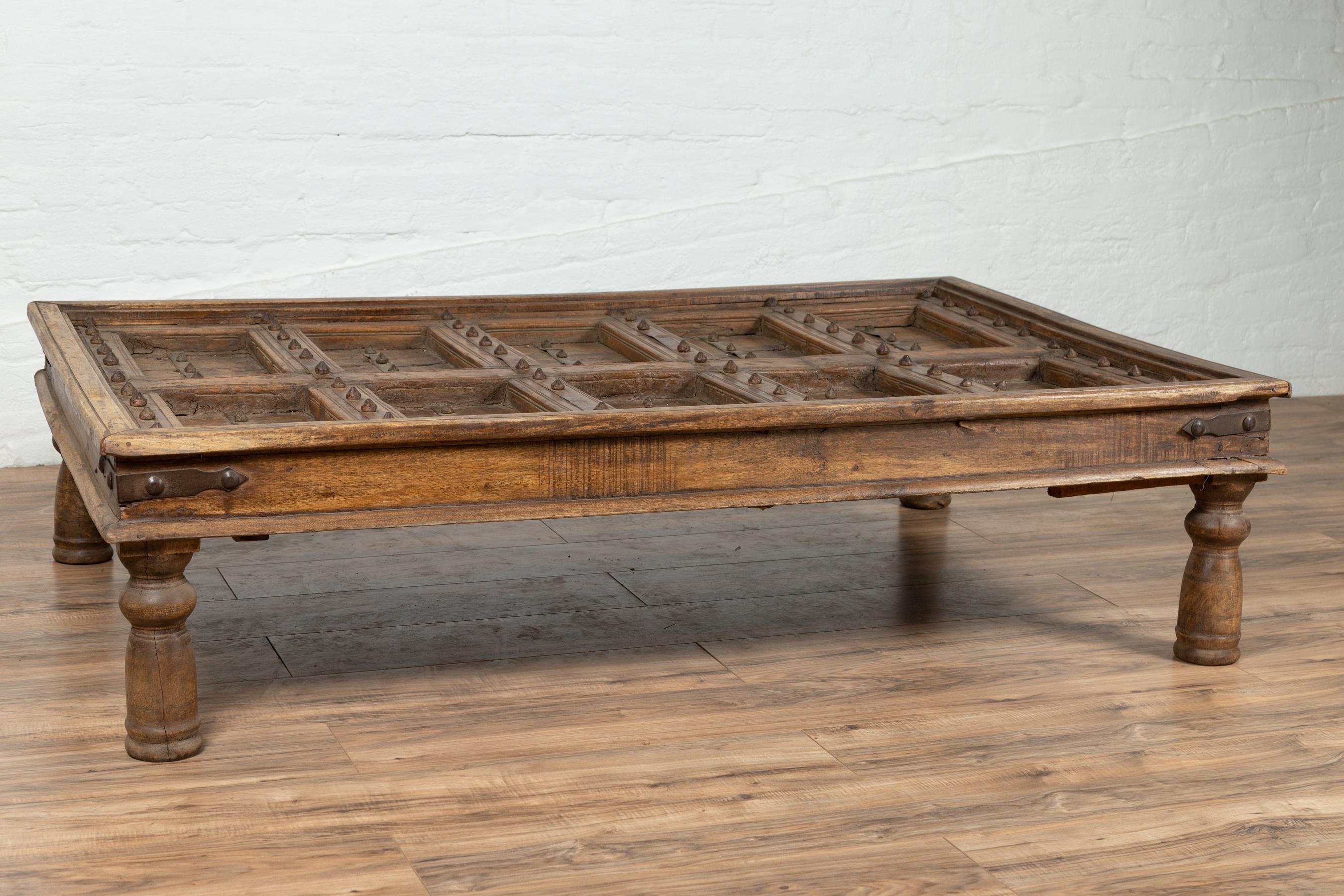 Antique Indian Wooden Palace Door Made into a Coffee Table with Iron Braces 3