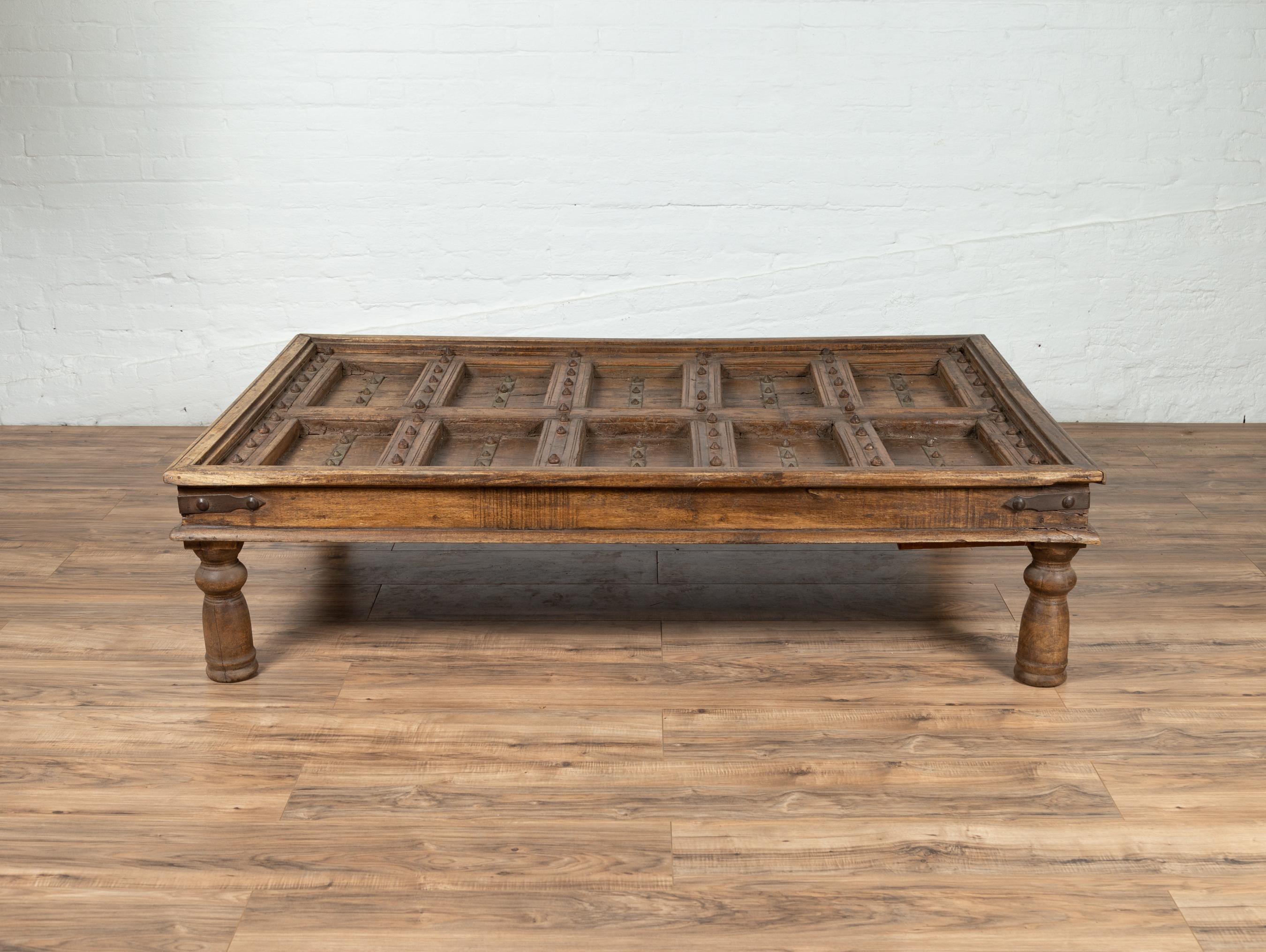 Antique Indian Wooden Palace Door Made into a Coffee Table with Iron Braces 4