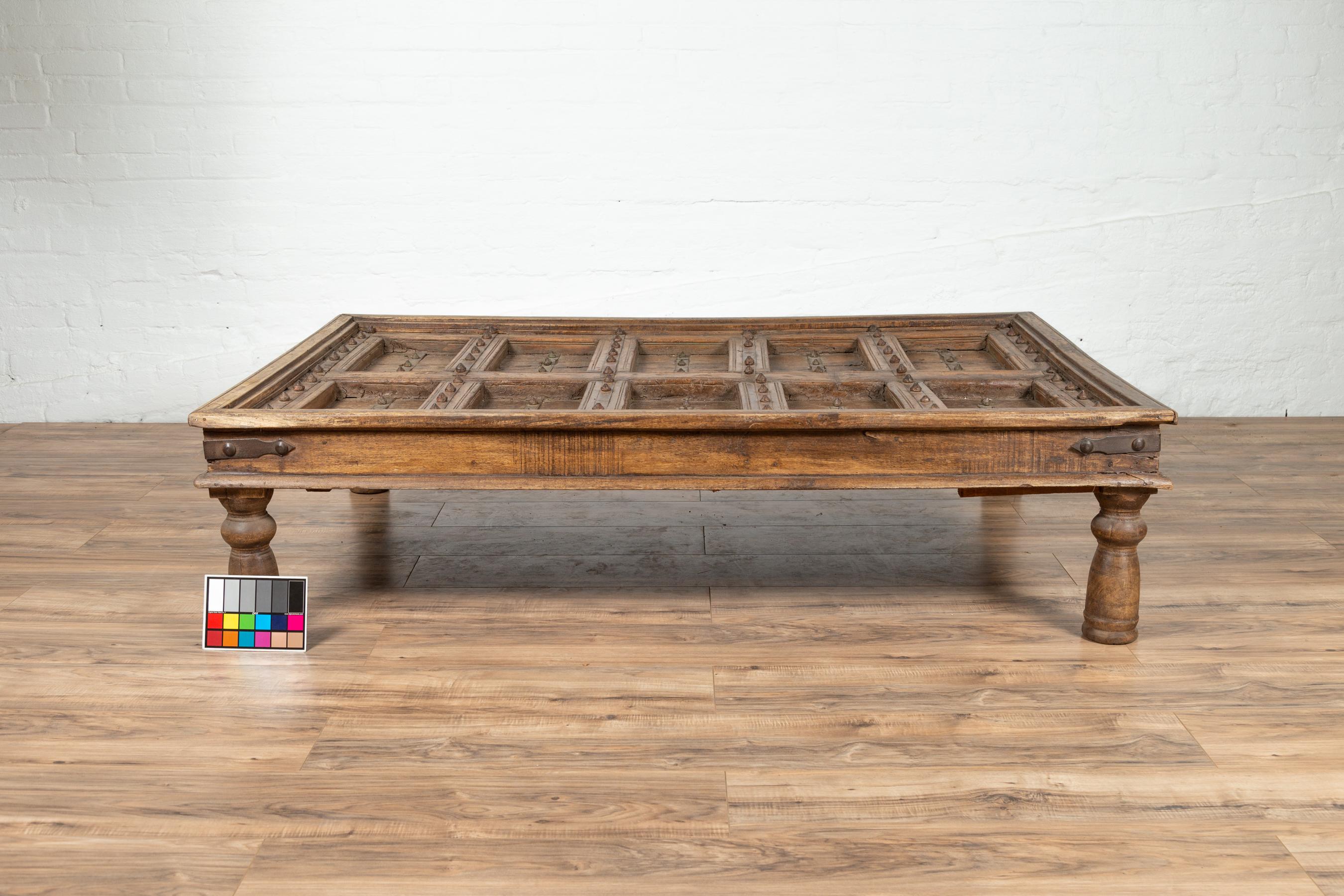 Antique Indian Wooden Palace Door Made into a Coffee Table with Iron Braces 5