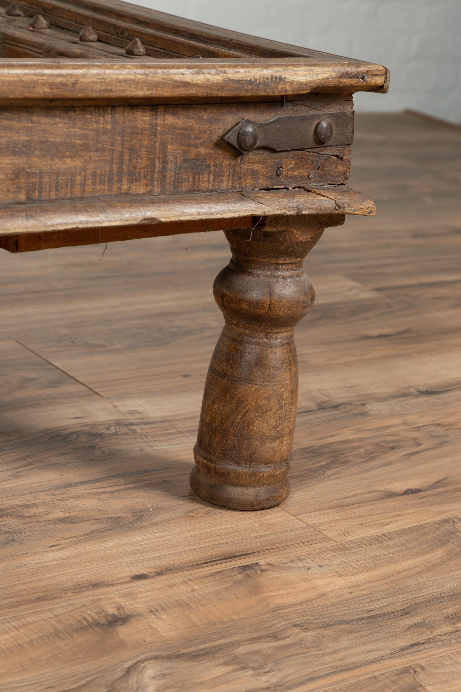 Rustic Antique Indian Wooden Palace Door Made into a Coffee Table with Iron Braces