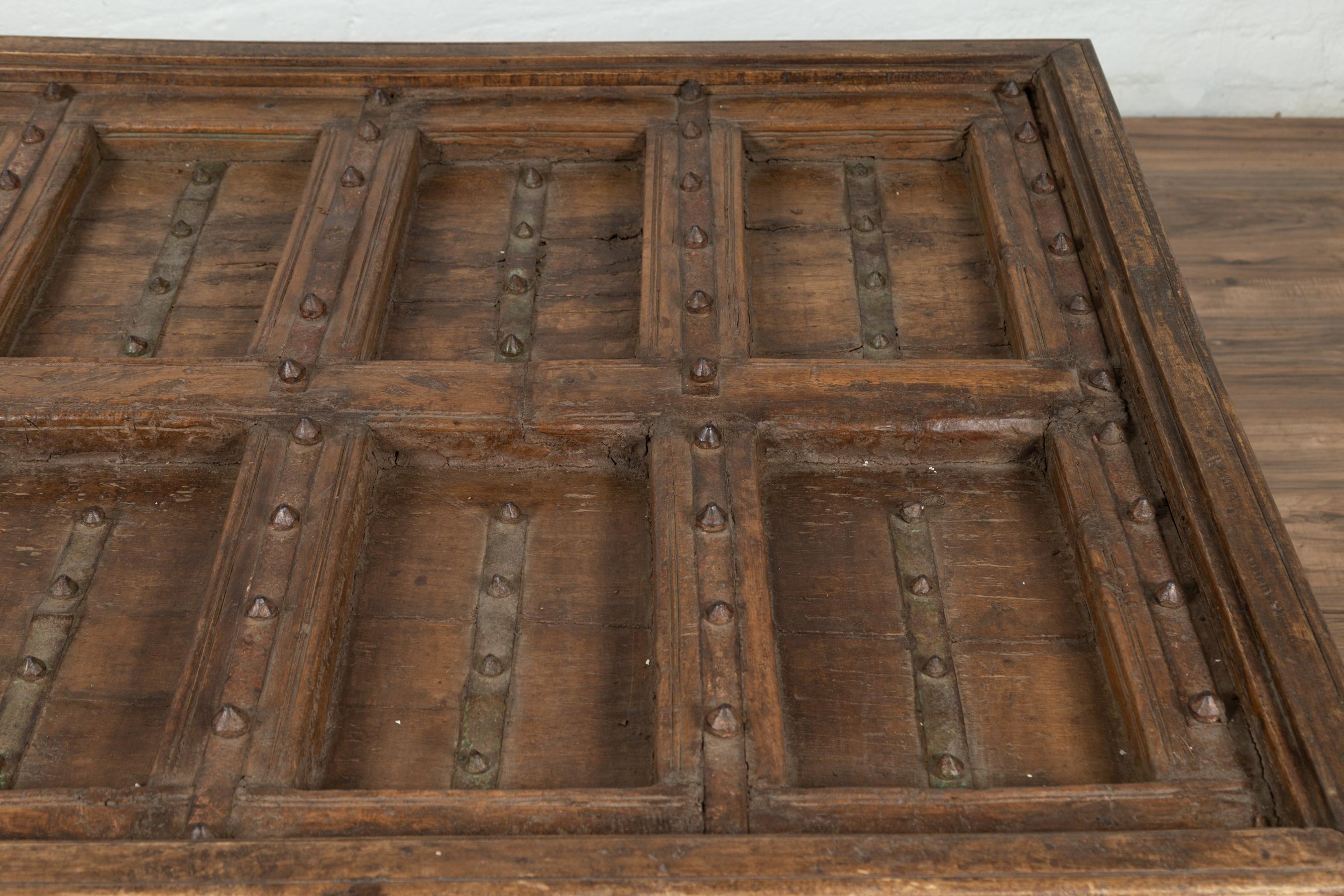 Antique Indian Wooden Palace Door Made into a Coffee Table with Iron Braces In Good Condition In Yonkers, NY
