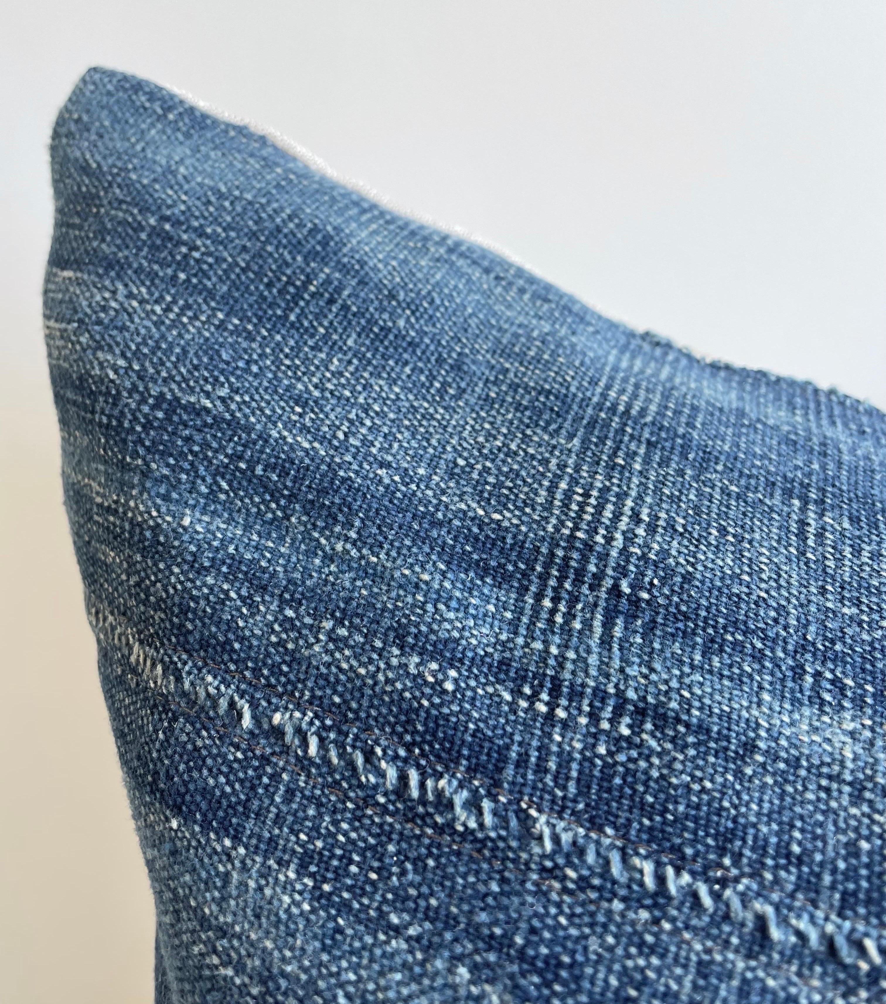 Antique faded blue indigo stripe African mudcloth pillows with original fringe details. Fabric: Vintage hemp / cotton fabric front, natural colored linen fabric back. Due to the nature of vintage textiles, there may be fading or markings. While they