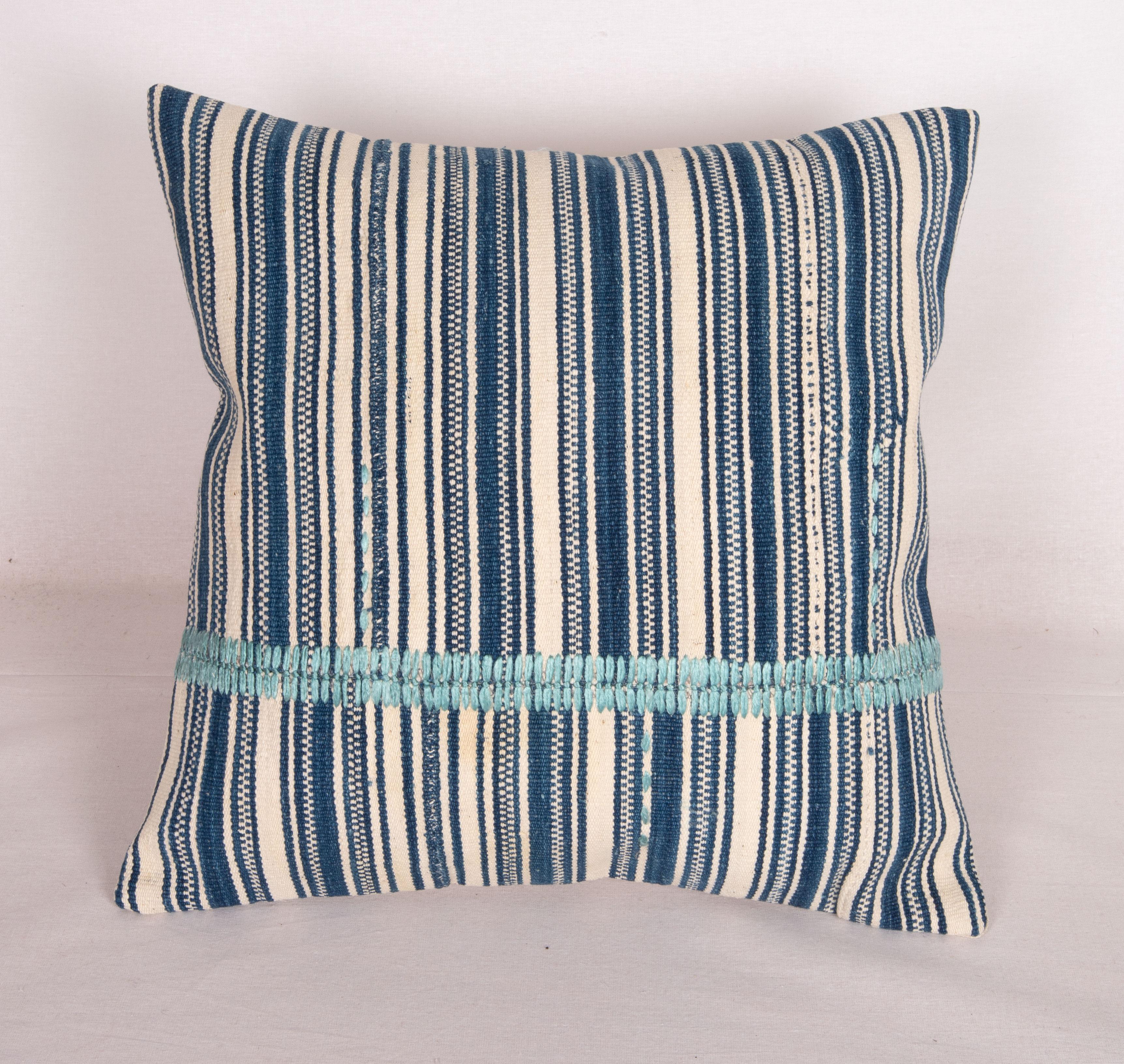 Pillow Cover was made from an antique cotton stripped kilim. The stitching is hand done in silk in our studio.
It does not come with an insert.
Linen in the back.
Zipper Colsure.
Dry Celaining is reccommended.