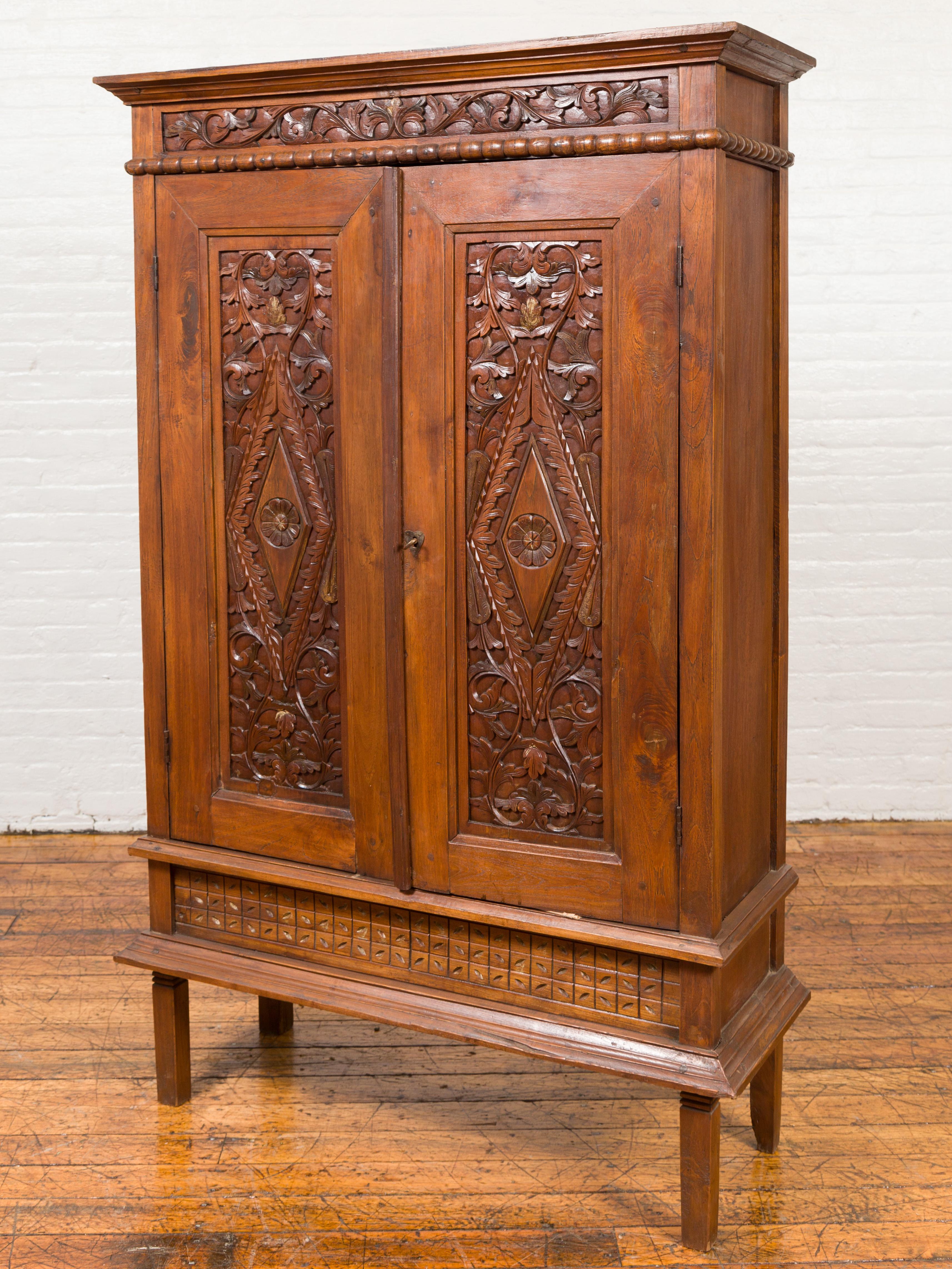 Antique Indonesian Cabinet with Carved Scrolling Foliage and Elongated Diamonds In Good Condition In Yonkers, NY