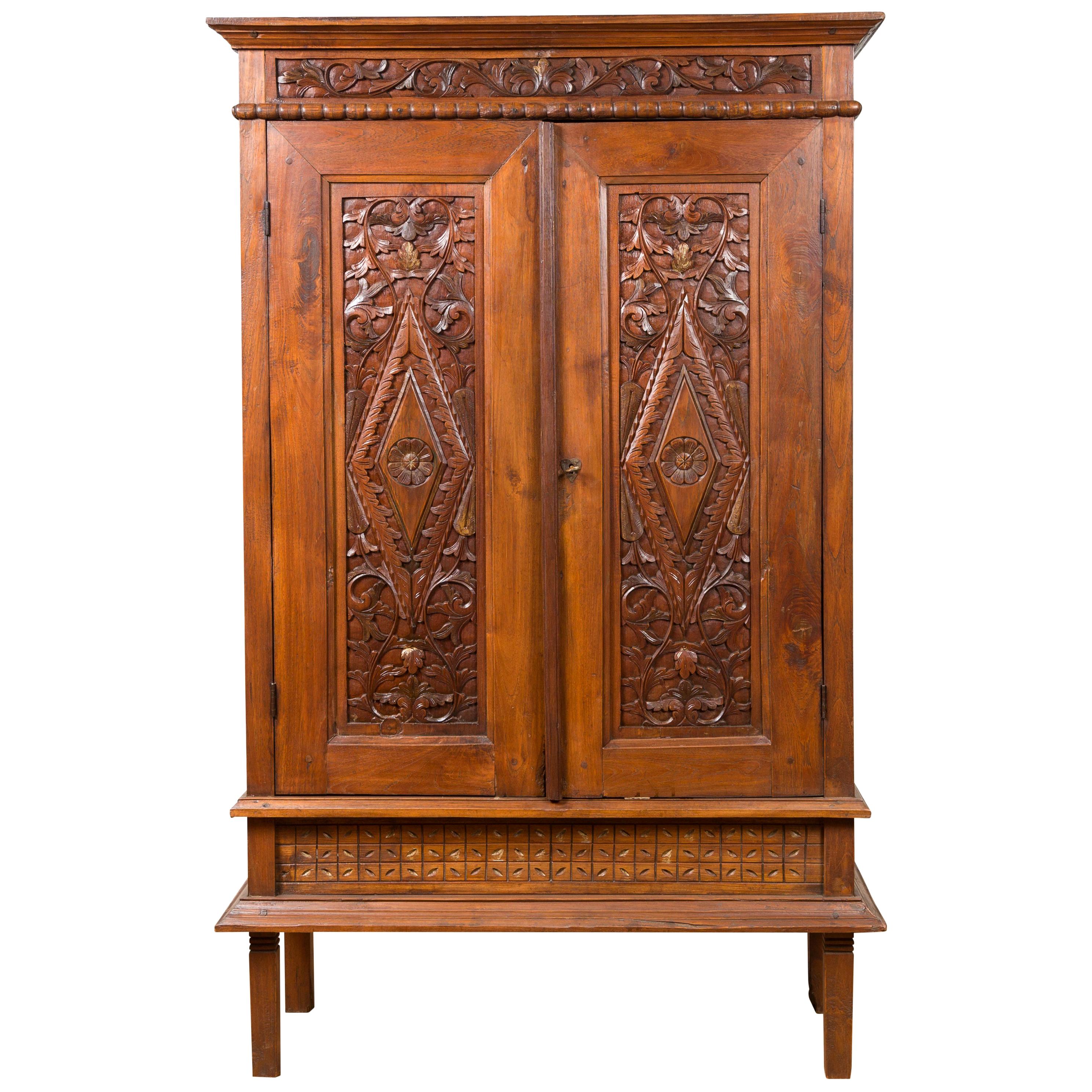 Antique Indonesian Cabinet with Carved Scrolling Foliage and Elongated Diamonds