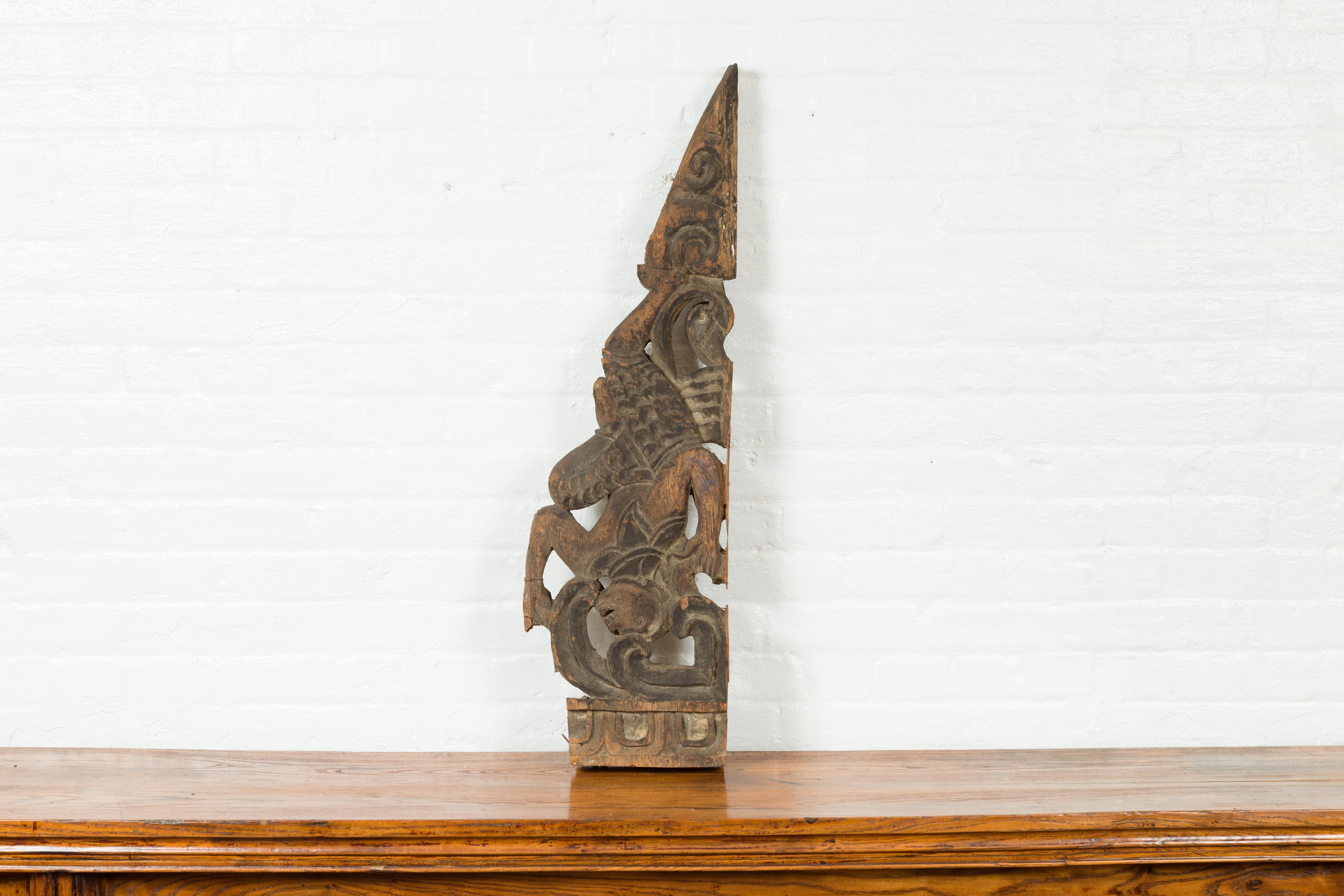Antique Indonesian Carved Wooden Triangular Fragment Depicting a Falling Figure For Sale 3