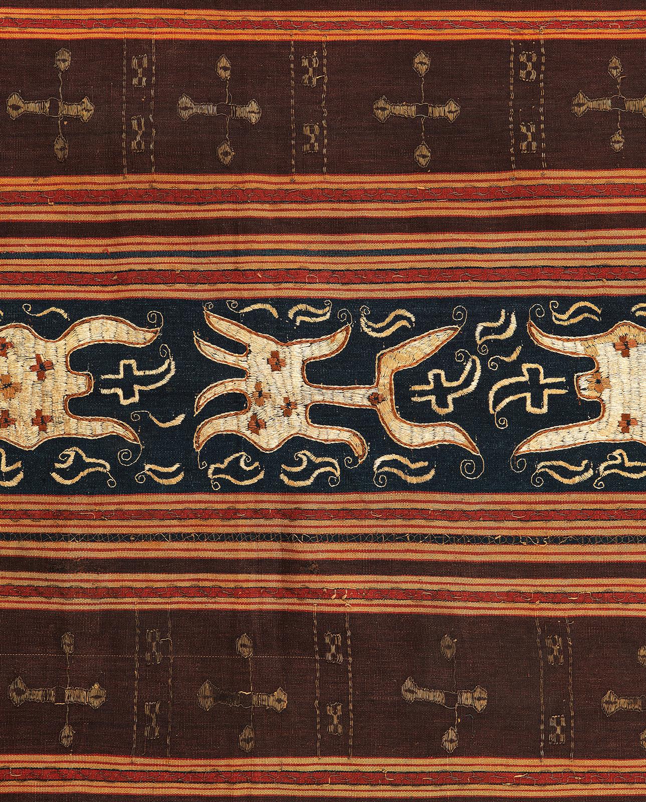 Tapis, Woman’s Ceremonial Skirt
Paminggir people, Lampung, Sumatra, Indonesia
Late 19th or early 20th century
Silk, metallic thread, handspun cotton, natural dyes, embroidery
48 x 48 inches  (120 x 120 cm)

The design shows large cumi cumi (squid)