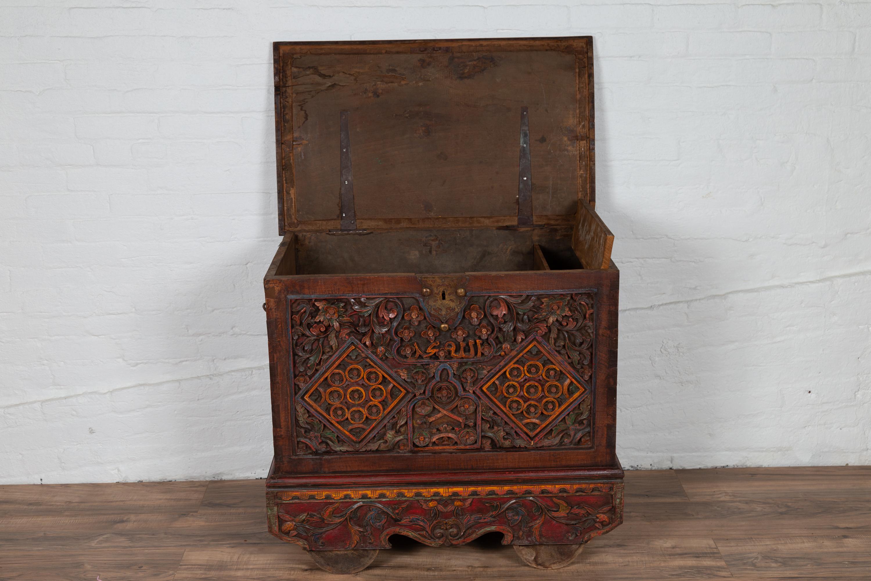 Antique Indonesian Hand Carved Blanket Chest with Polychrome Decor and Wheels In Good Condition In Yonkers, NY