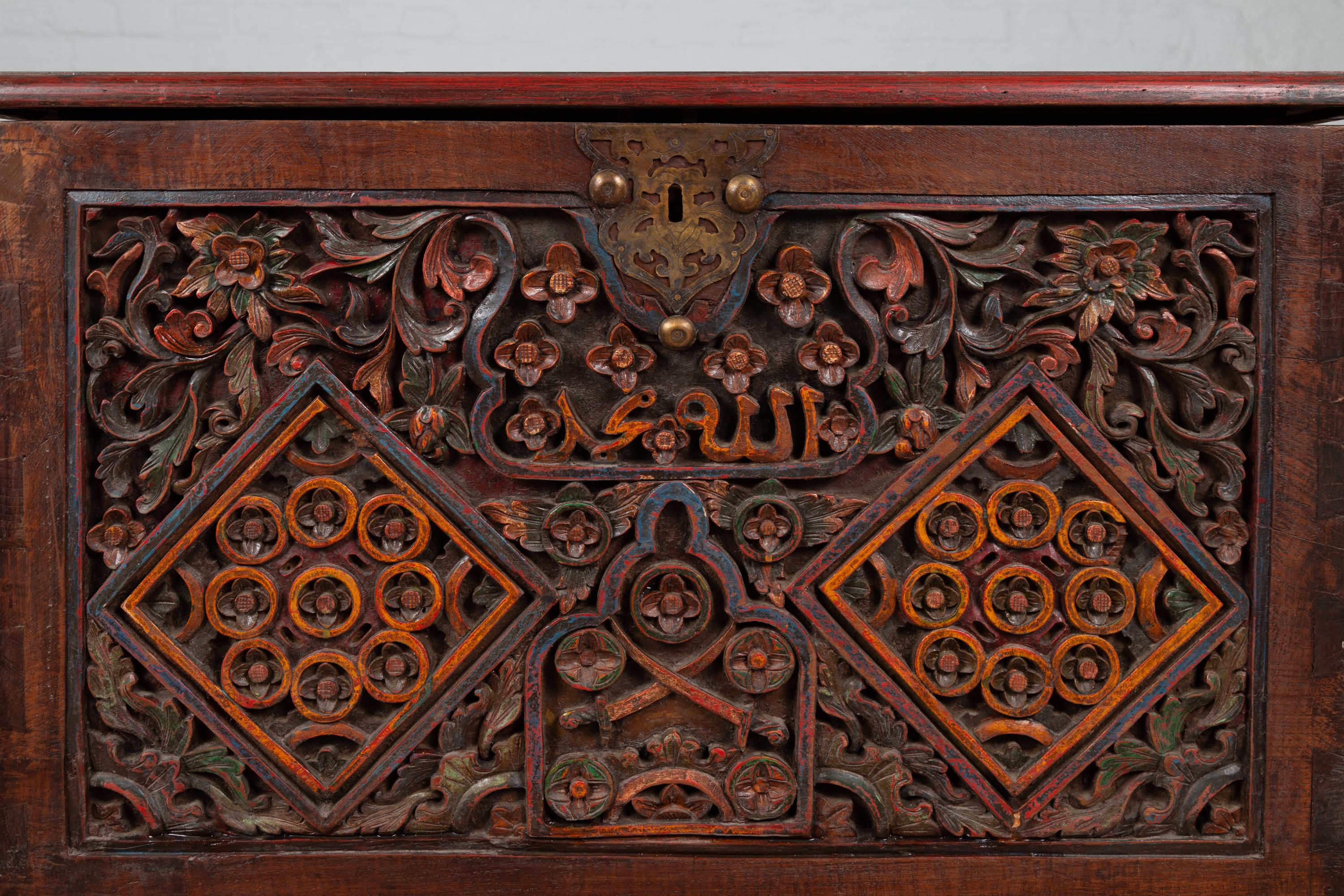 20th Century Antique Indonesian Hand Carved Blanket Chest with Polychrome Decor and Wheels