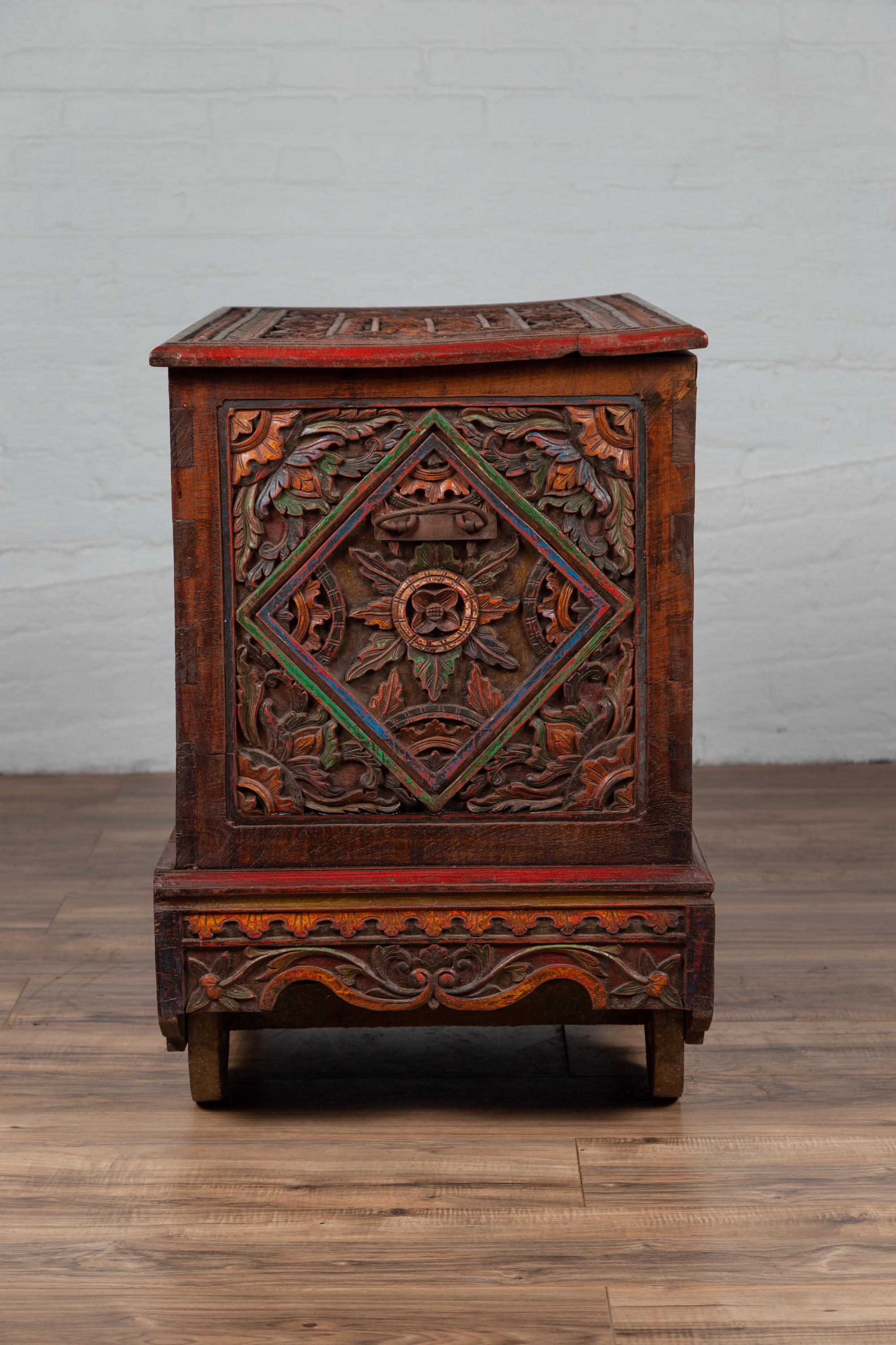Antique Indonesian Hand Carved Blanket Chest with Polychrome Design and Wheels 14