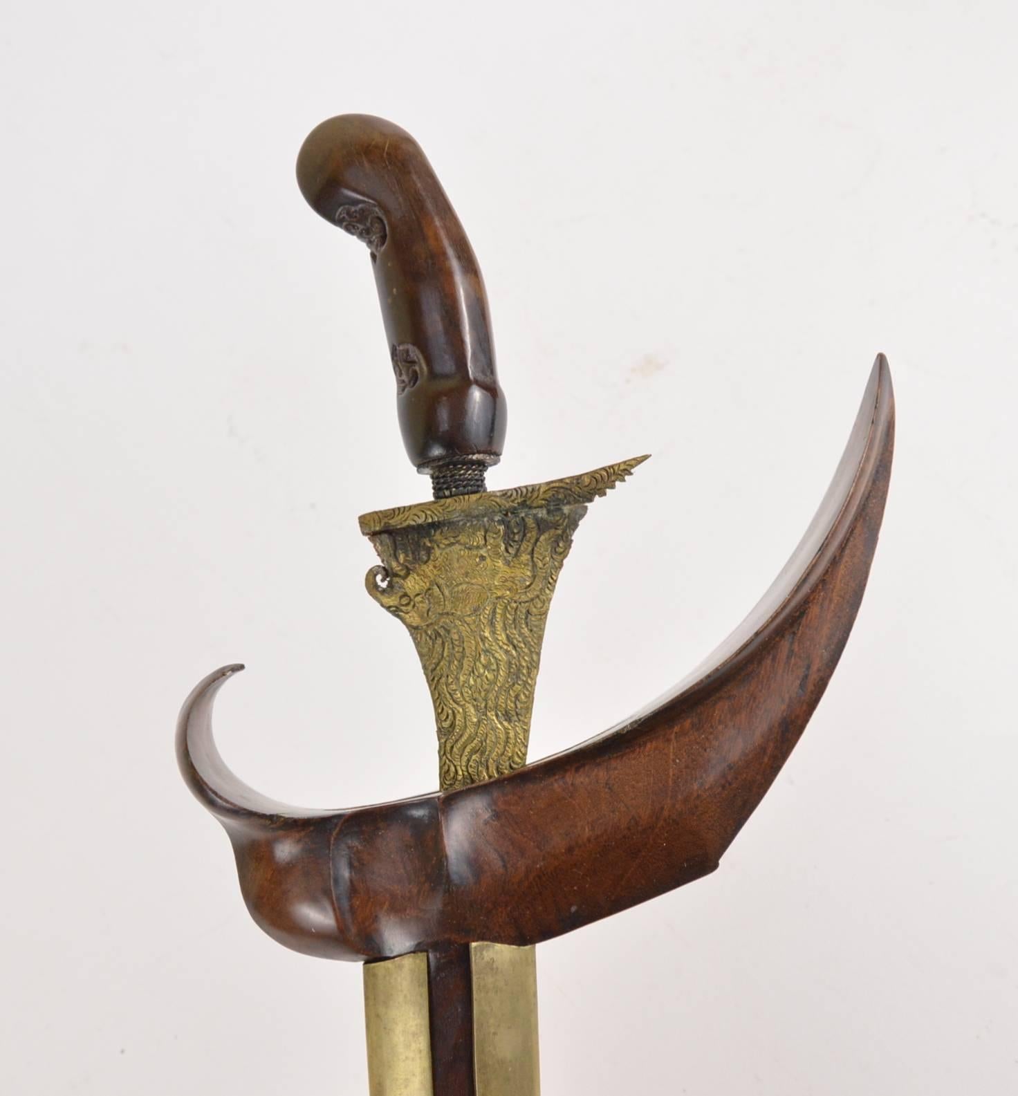 Antique Indonesian Kris dagger with wooden handle.
 