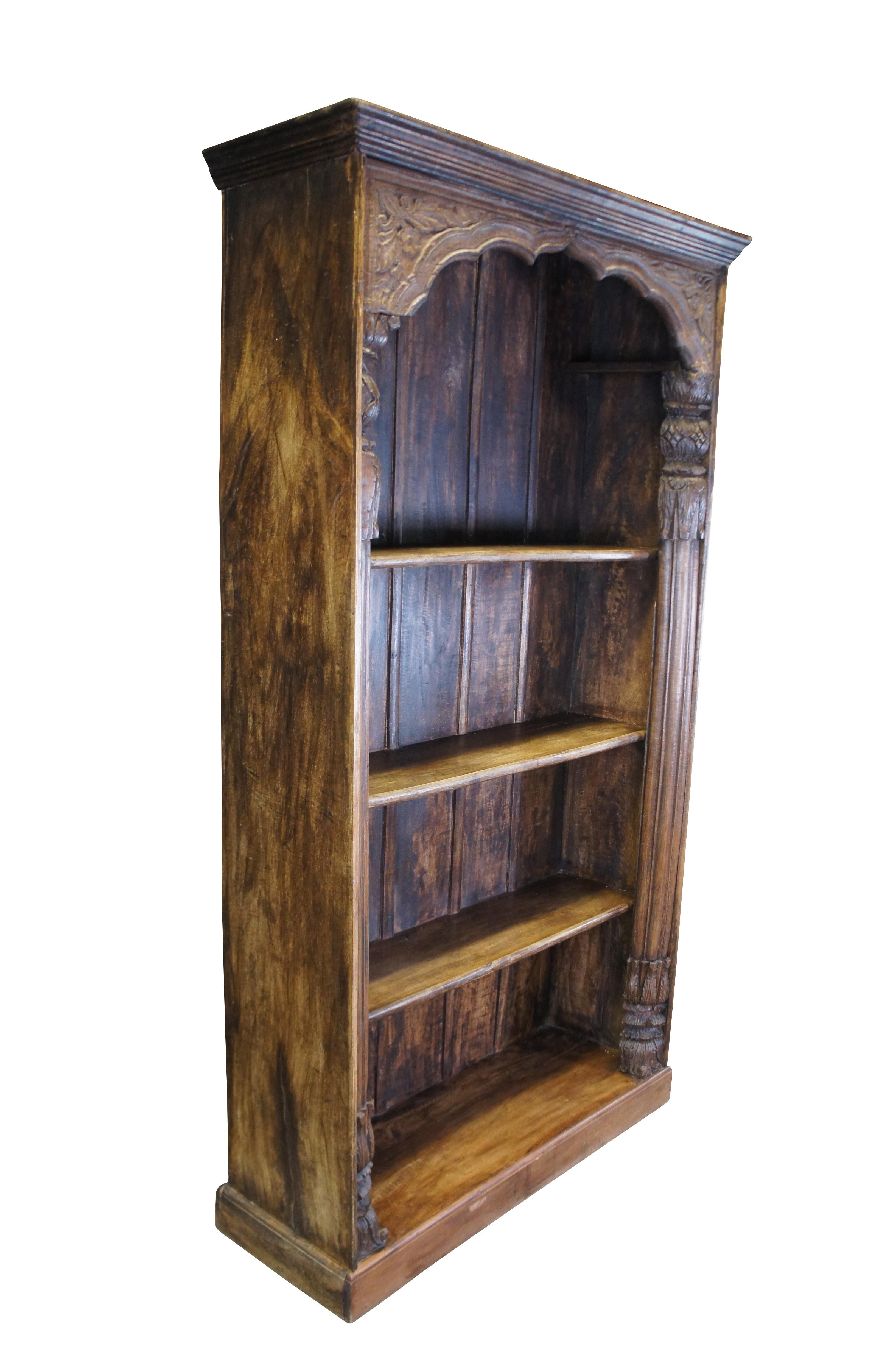 Antique Indonesian / Indian reclaimed library / farmhouse bookshelf or bookcase.  Made of teak featuring a doorway or archway design with Corinthian columns and floral acanthus carvings.

Dimensions:
46