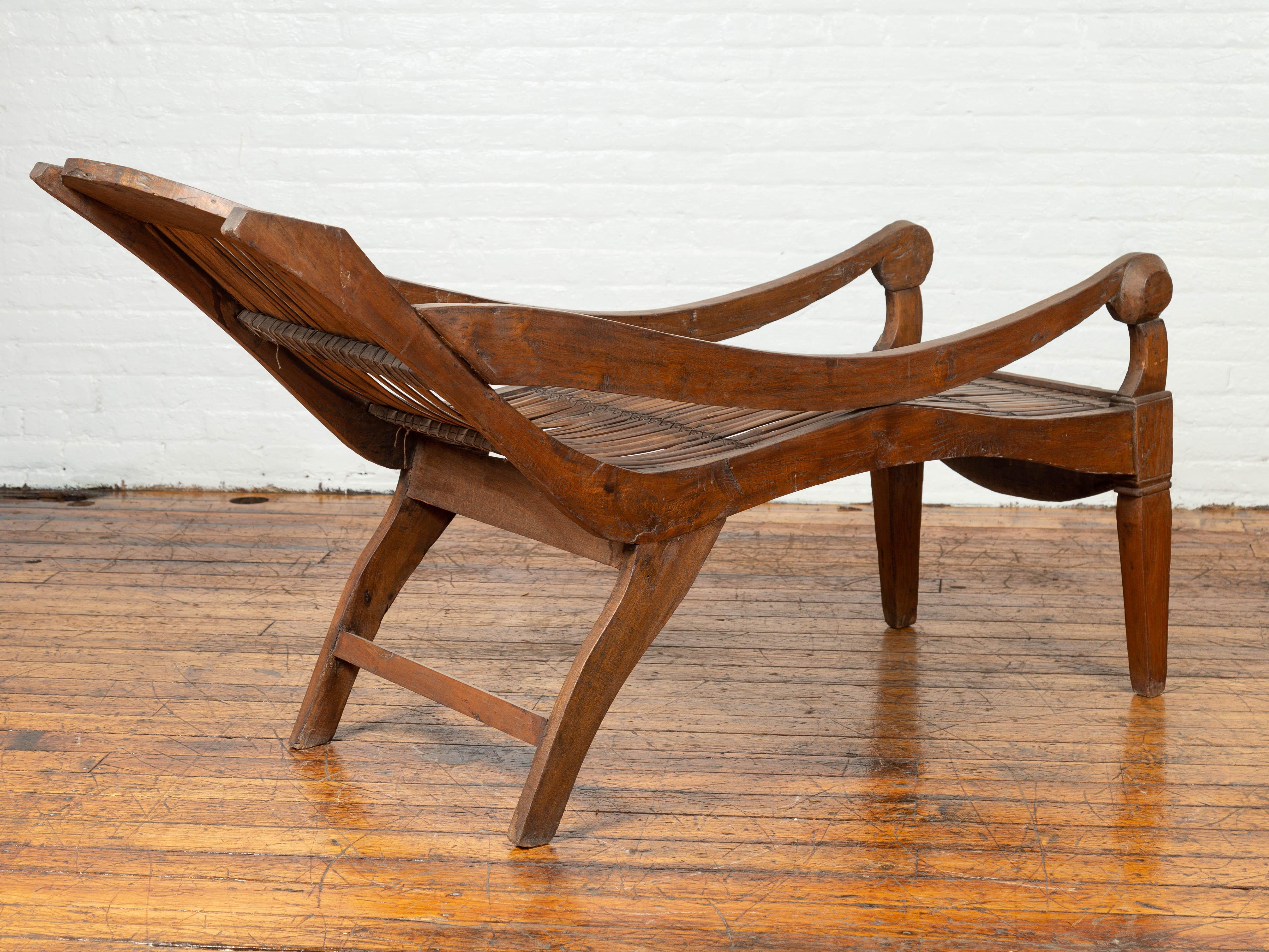 Antique Indonesian Reclining Plantation Chair with Bamboo Slats and Carved Décor For Sale 1