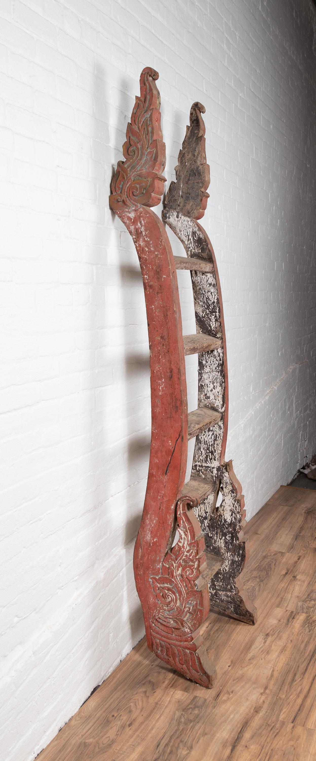 Antique Indonesian Red Painted and Hand Carved Ladder with Distressed Finish In Good Condition In Yonkers, NY