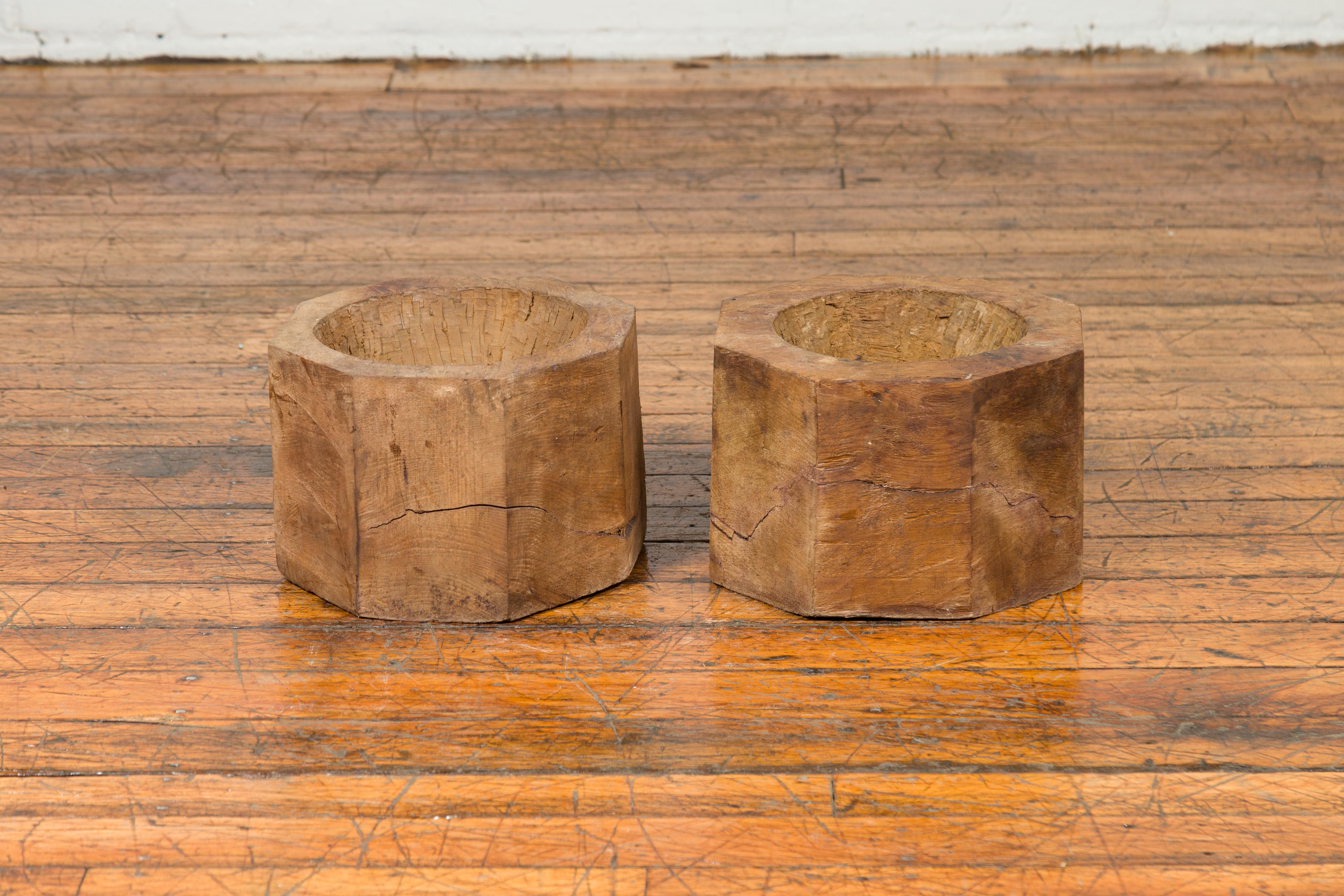An antique Indonesian rustic octagonal wooden planter made from a tree trunk, two available, priced and sold individually. They are $350 each. Charming our eyes with its nicely weathered appearance and simple lines, each planter is made of a tree