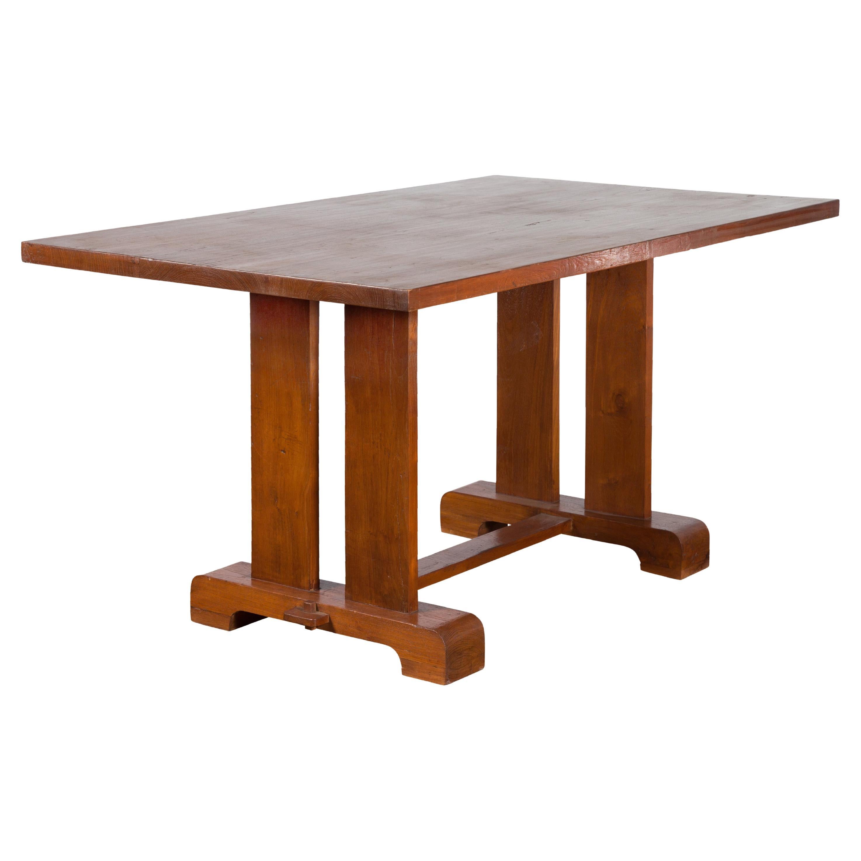 Antique Indonesian Teakwood Dining Table with Trestle Base and Brown Patina For Sale