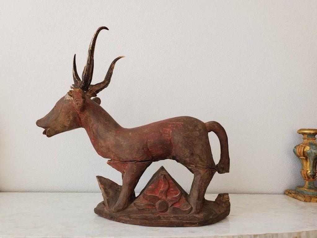 A rare and incredible Indonesian hand carved and painted red deer architectural salvaged temple ornament.

Dating to the 19th century or earlier, hand-crafted in Southeast Asia, likely Bali, Java, possibly Burma, the antique religious folk art