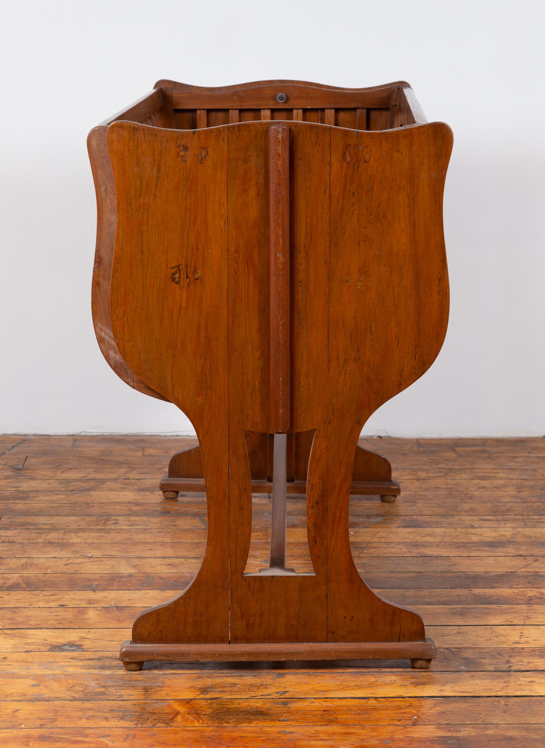 Indonesian Antique Wooden Baby Cradle on Trestle Base Transforming into a Loveseat For Sale