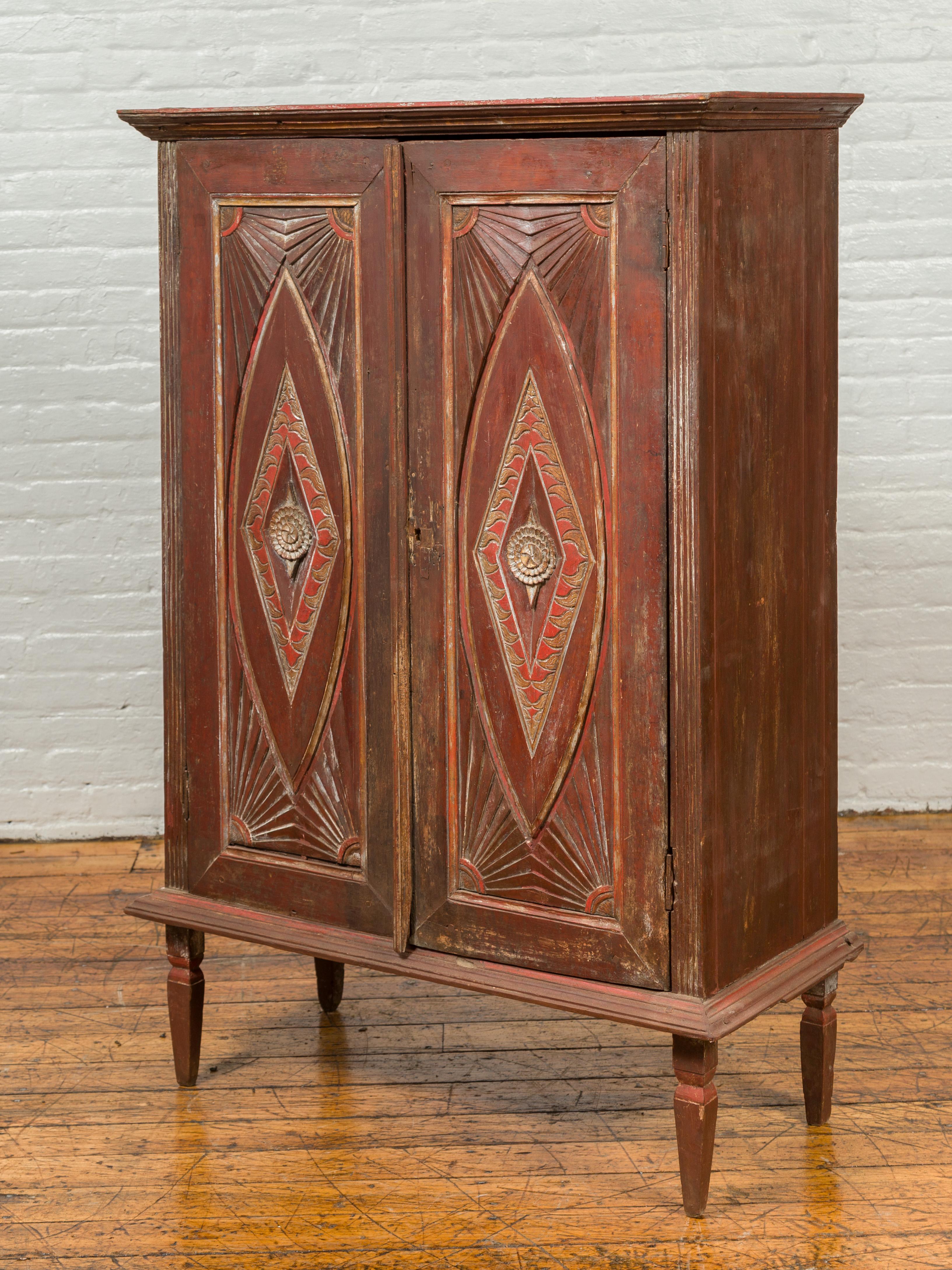 Antique Indonesian Wooden Cabinet with Carved and Painted Geometric Motifs In Good Condition For Sale In Yonkers, NY