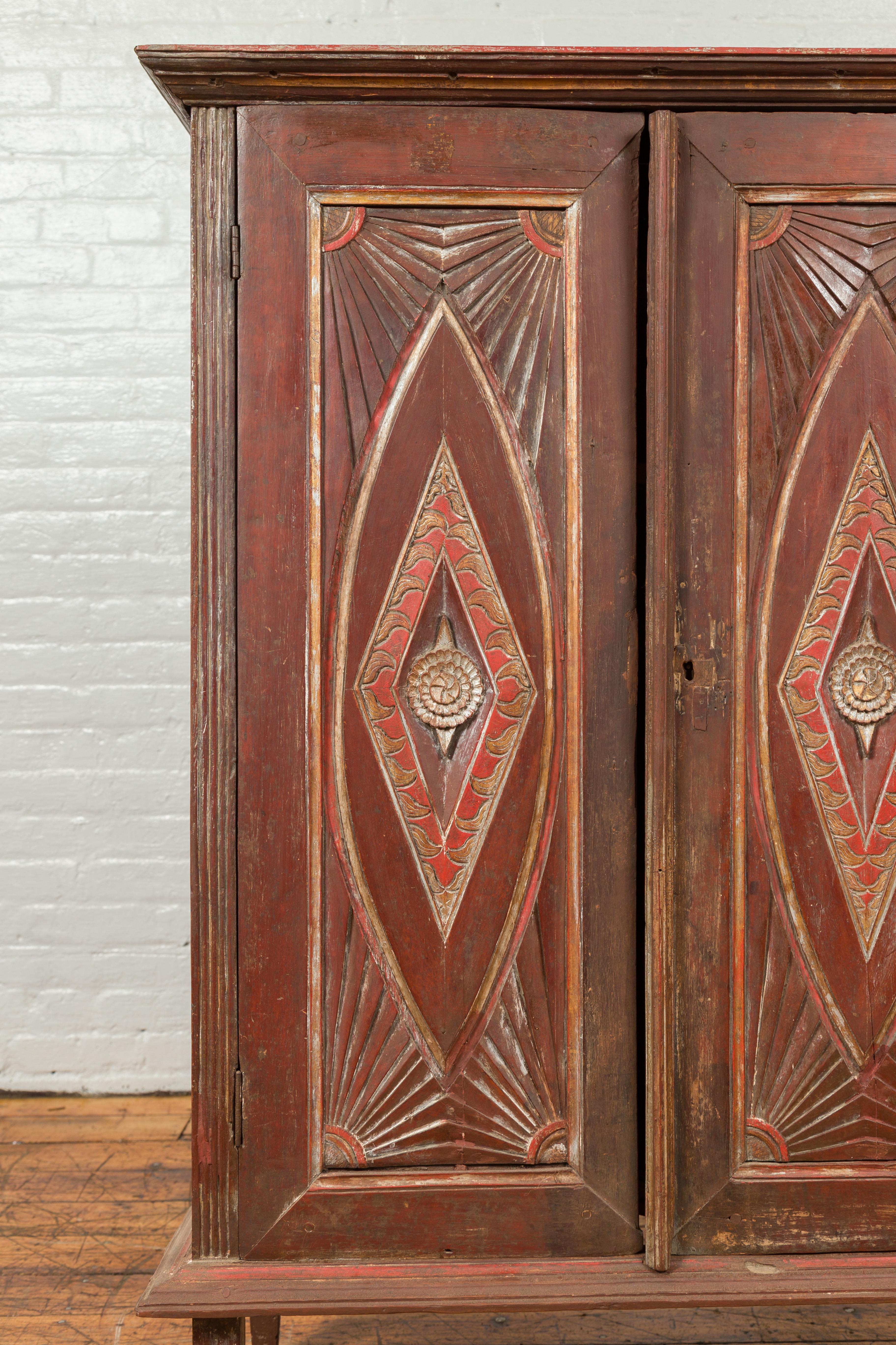 Antique Indonesian Wooden Cabinet with Carved and Painted Geometric Motifs For Sale 1