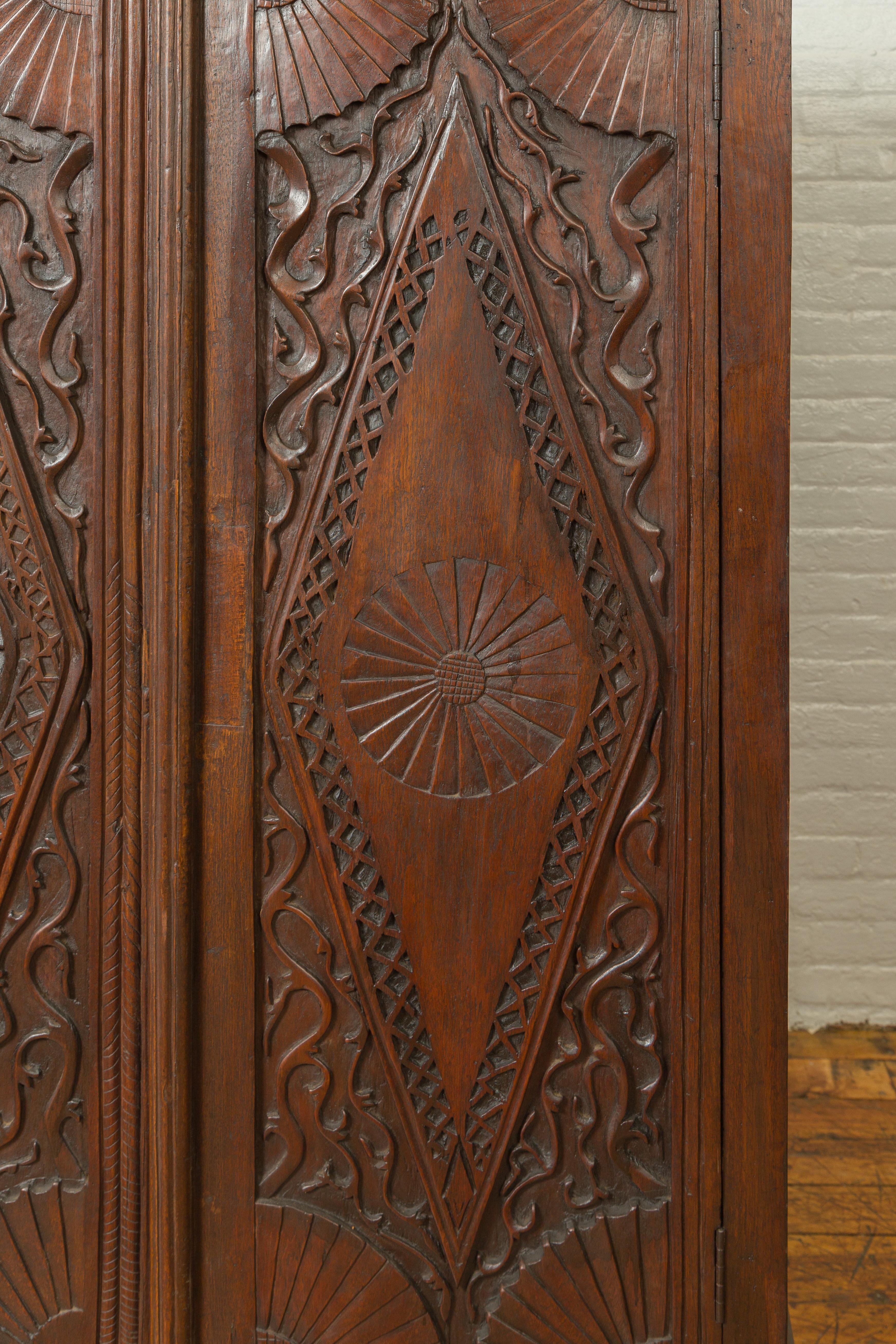 Antique Indonesian Wooden Cabinet with Carved Diamond Motifs and Medallions 2