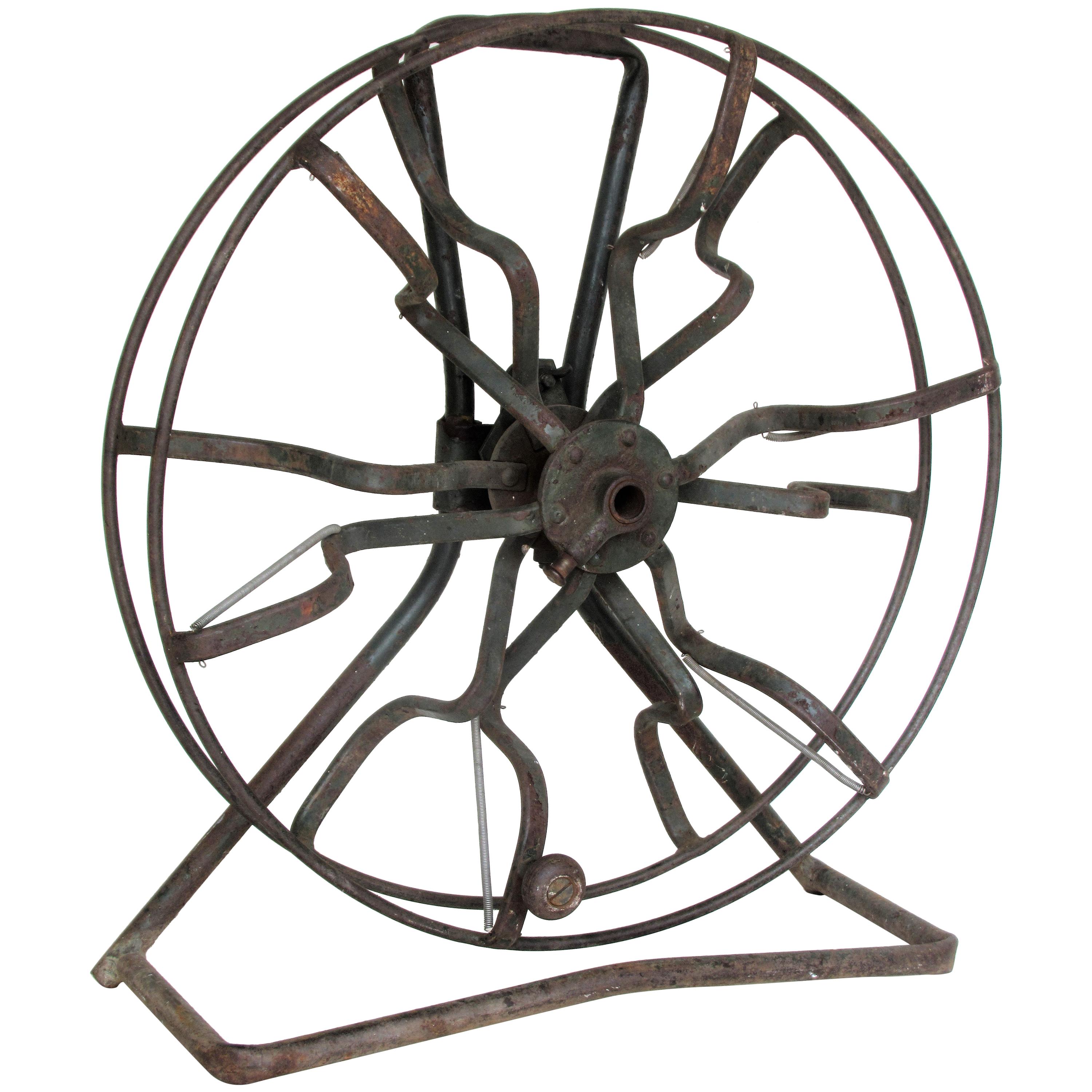 https://a.1stdibscdn.com/antique-industrial-americana-iron-fire-hose-reel-for-sale/1121189/f_115688831533011860824/11568883_master.jpg