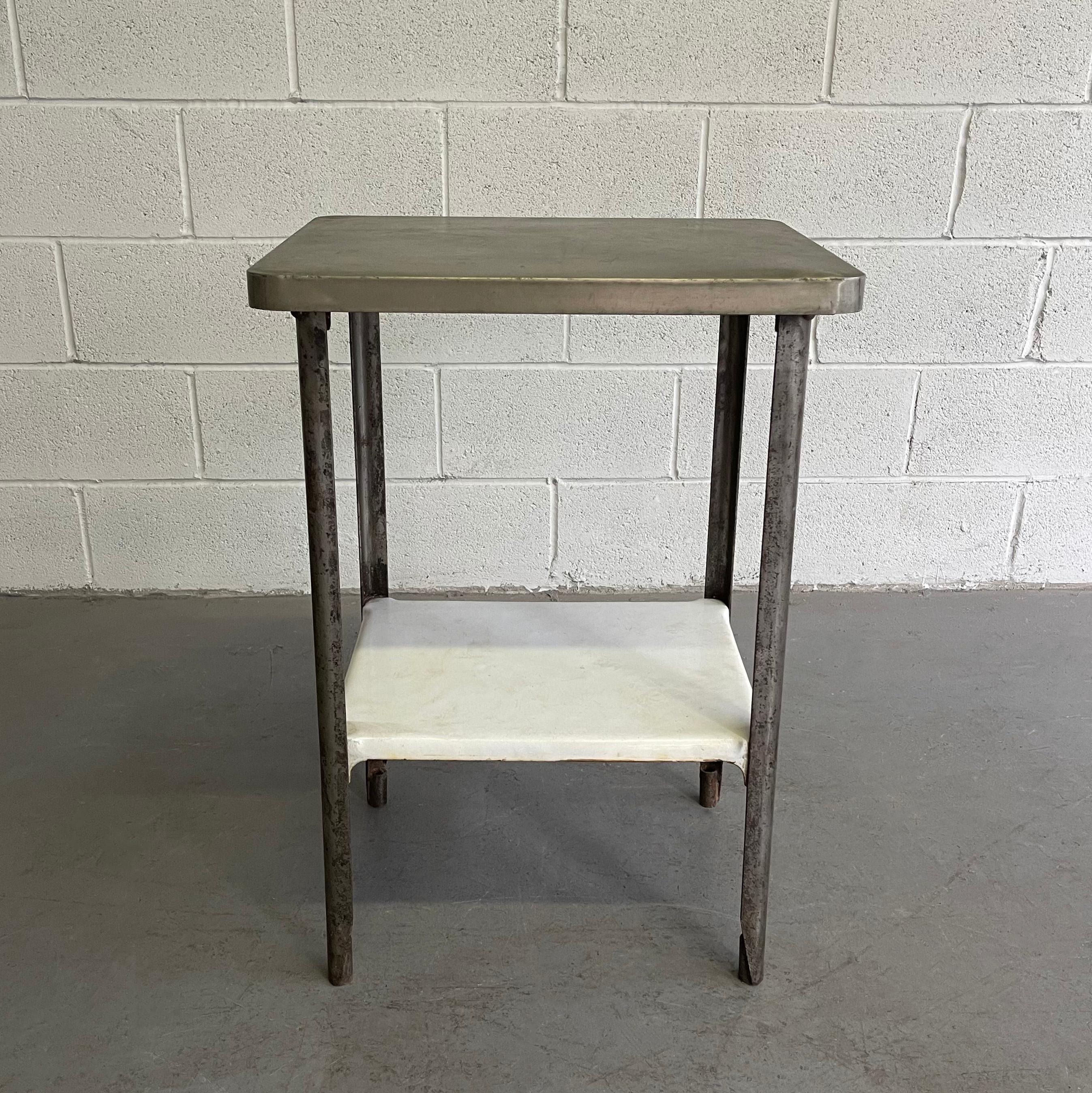 Antique, industrial, zinc covered, cast iron, apothecary prep table features an enameled cast iron lower shelf at 11 inches height.