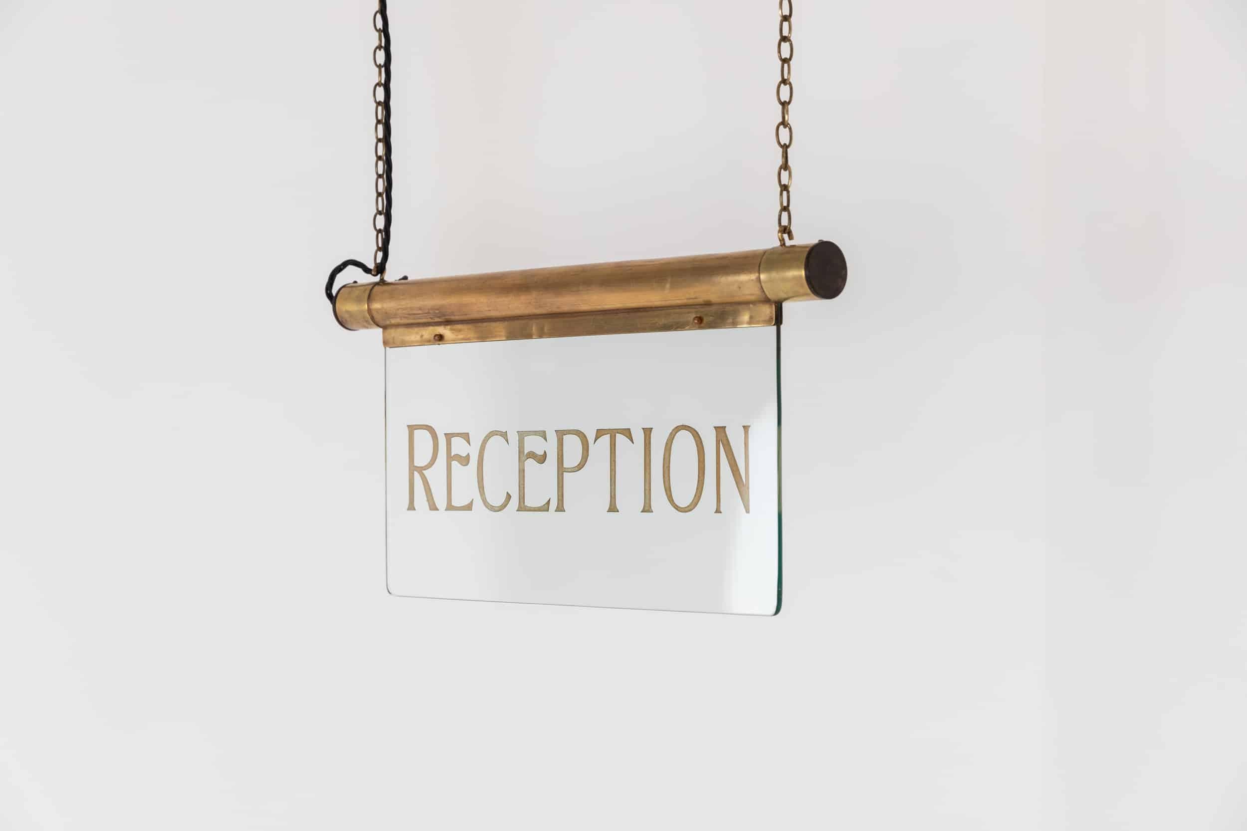 glass reception sign