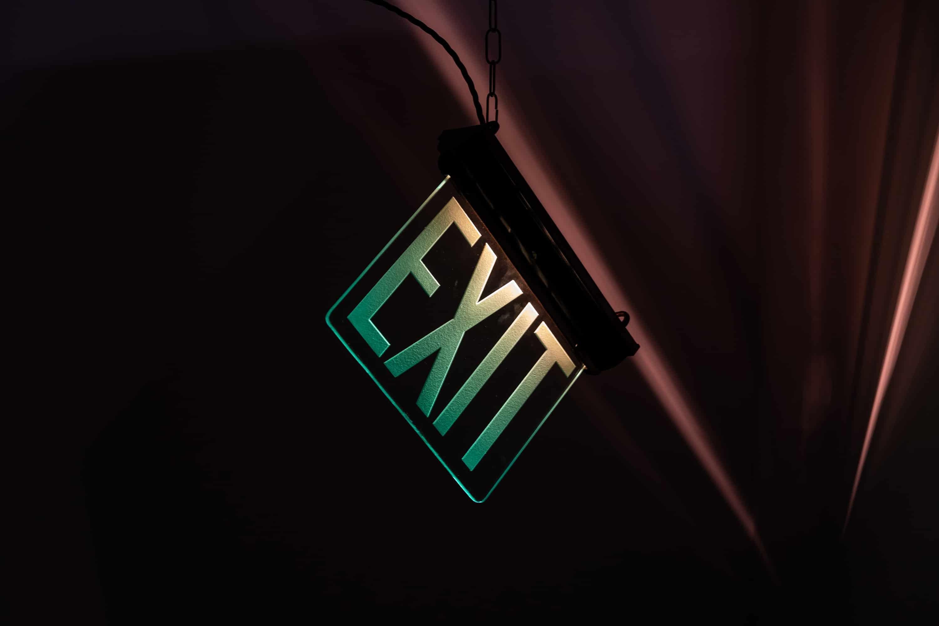 A stunning illuminated directional sign made in England, circa 1920.

Black painted steel frame housing the internal illuminations above polished plate glass deep etched with 'Exit'.

Rewired with 1m black twisted flex.