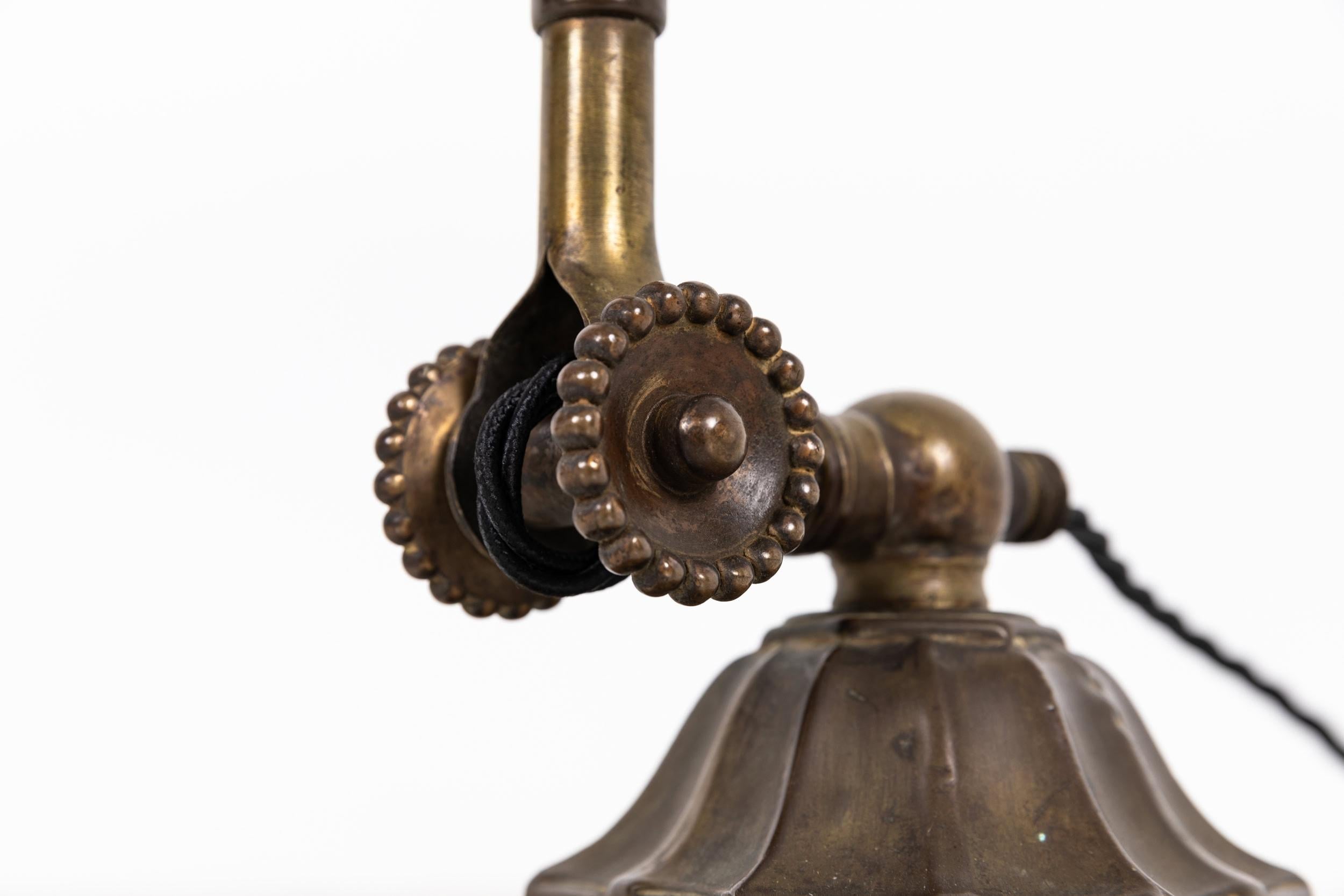 

Very original example of an early Dugdills desk lamp. c.1915

Surviving inn wonderful original condition, with the cast rosettes and domed enamel shade. Faceted heavy duty base embossed with Dugdills maker's mark.

Rewired with 2m of black twist