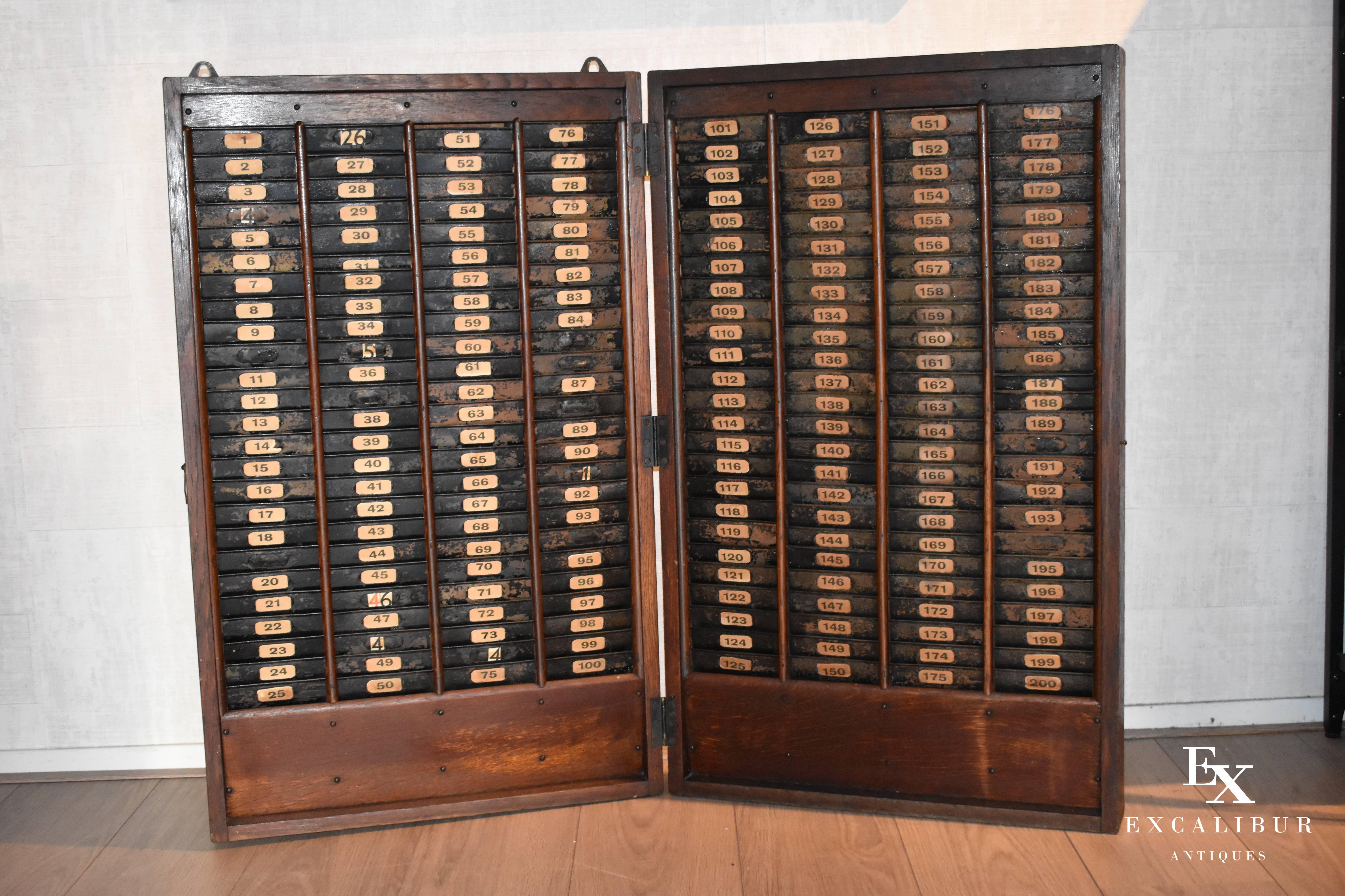 Antique industrial factory worker time card rack

This impressive time card rack was used by workers of a factory to store their punching cards in the early 1900s. Each factory worker had his own card and corresponding number which registrated the