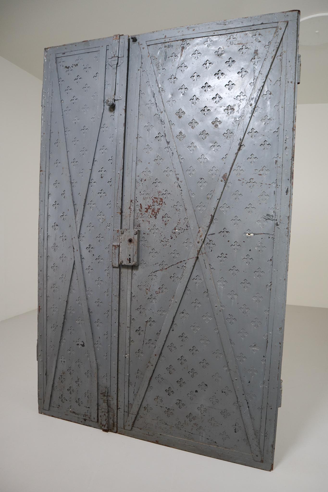 These gorgeous mid-18th century entry doors from Northern Italy are constructed from iron. Perfect to incorporate in a industrial interior or as a decorative object and would make an eye-catching addition to any interior. Fabulous patina.