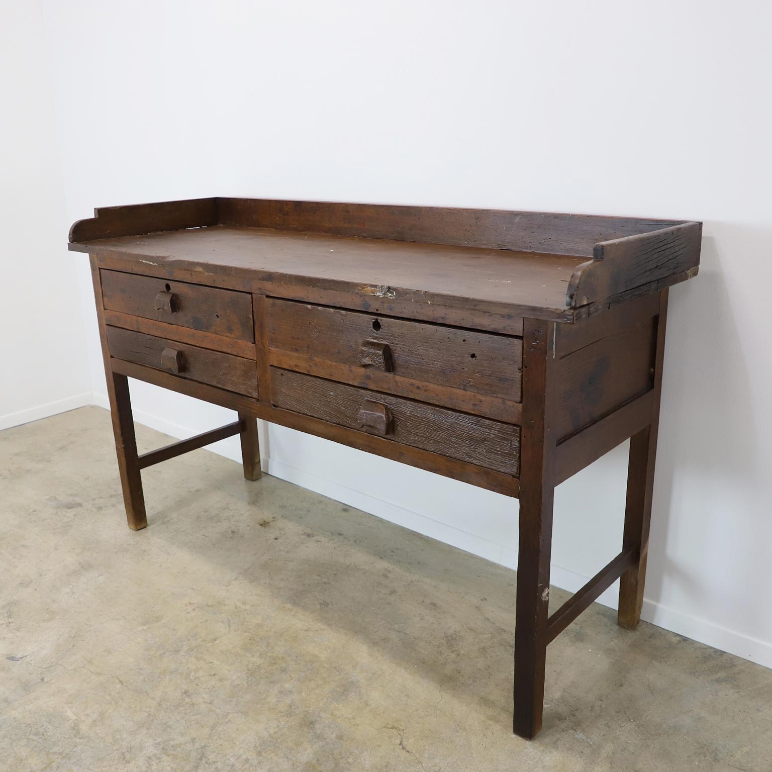 Circa 1930. We offer a most unique antique Mexican Industrial Jeweler's Bench Work Table with outstanding patina.

The stool and the typewriter is not included.