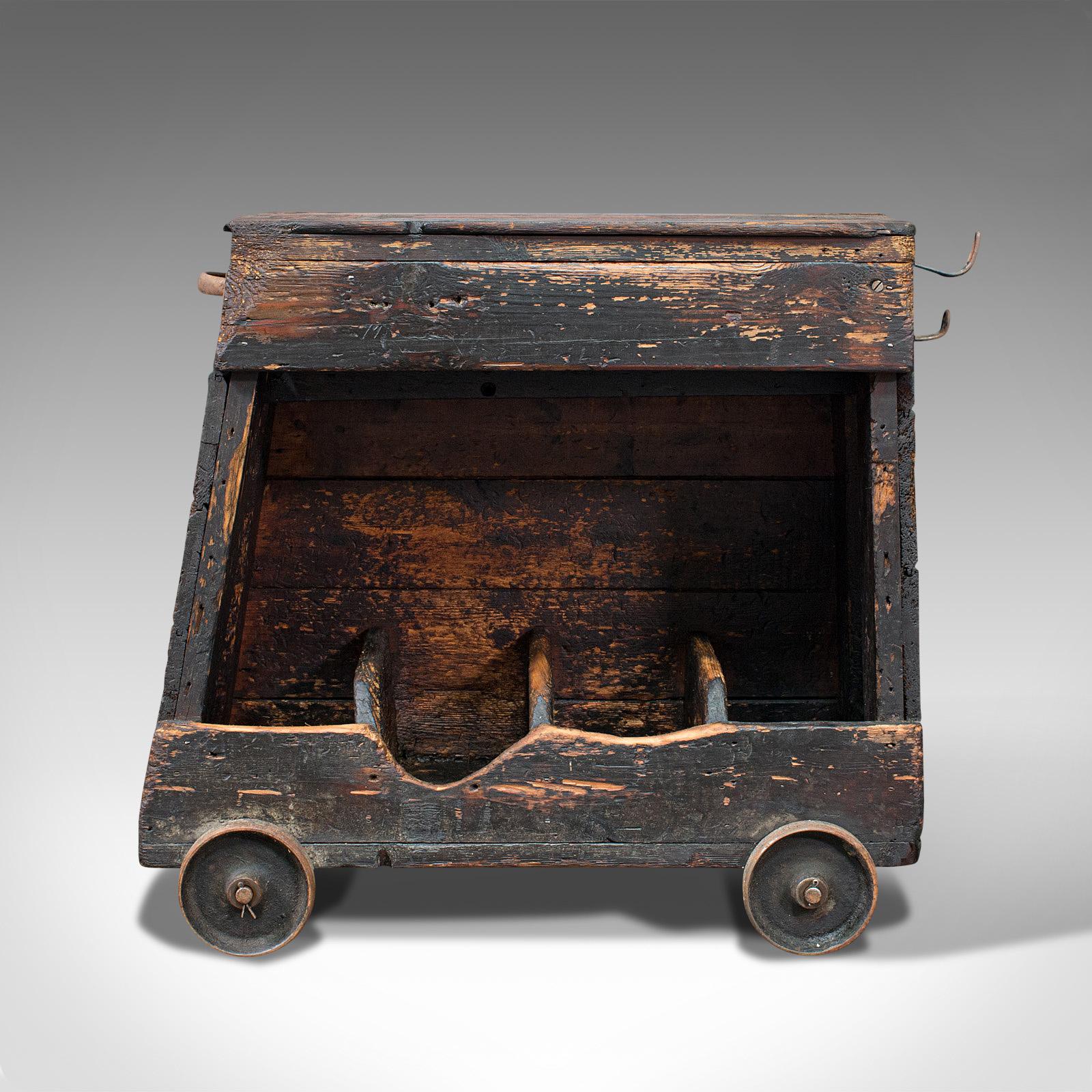This is an antique industrial machinist's truck. An English, pine trolley suitable for the kitchen or wine, dating to the late Victorian period, circa 1900.

Wonderfully naive but solidly crafted mobile caddy
Displaying a desirable industrial