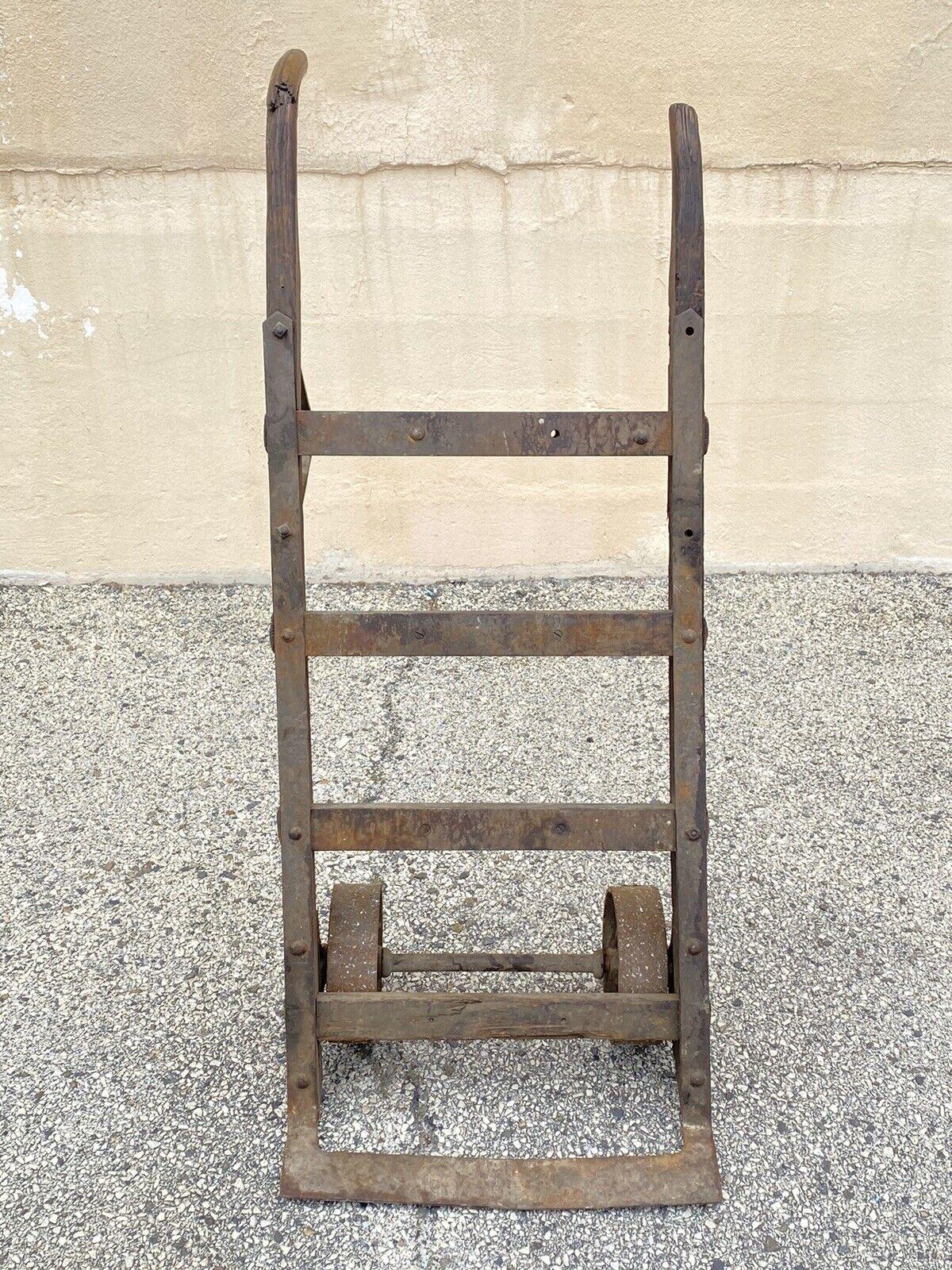 Antique American Industrial Modern Vintage Factory Hand Truck with Oak Wood and Iron Metal Frame. Circa Mid 20th Century.
Measurements: 
Upright: 51
