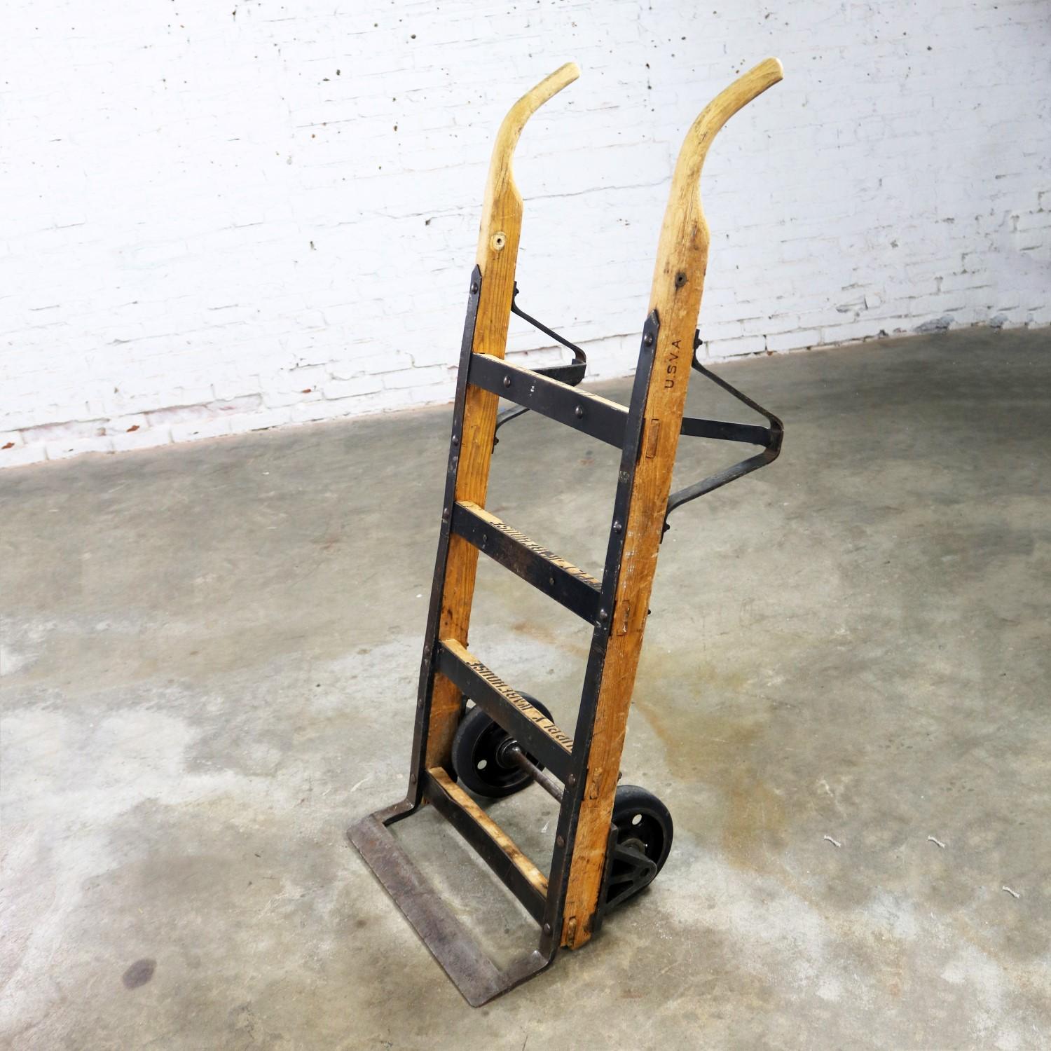 Awesome antique Industrial oak and hand-forged iron hand truck or trolley. It is marked K&J Columbus, Ohio. This would be an incredible start to a cool Industrial coffee table. It is in fabulous vintage condition with lots of gorgeous age patina.