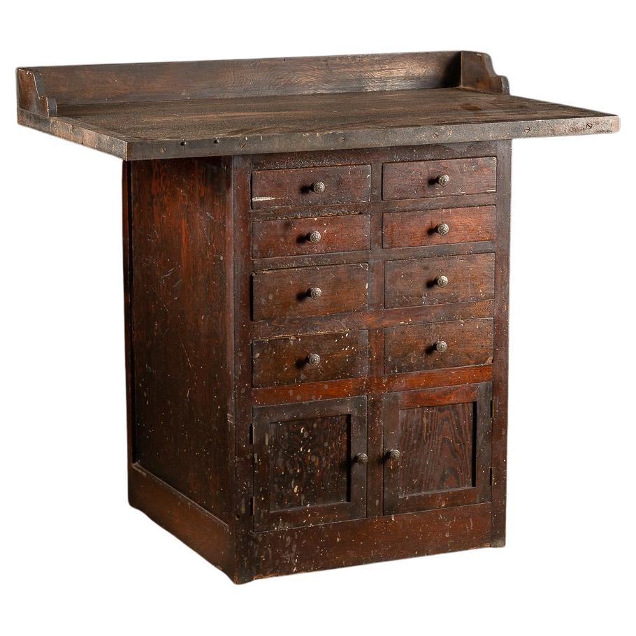 Banco de trabajo industrial antiguo con cajonera y separadores en venta