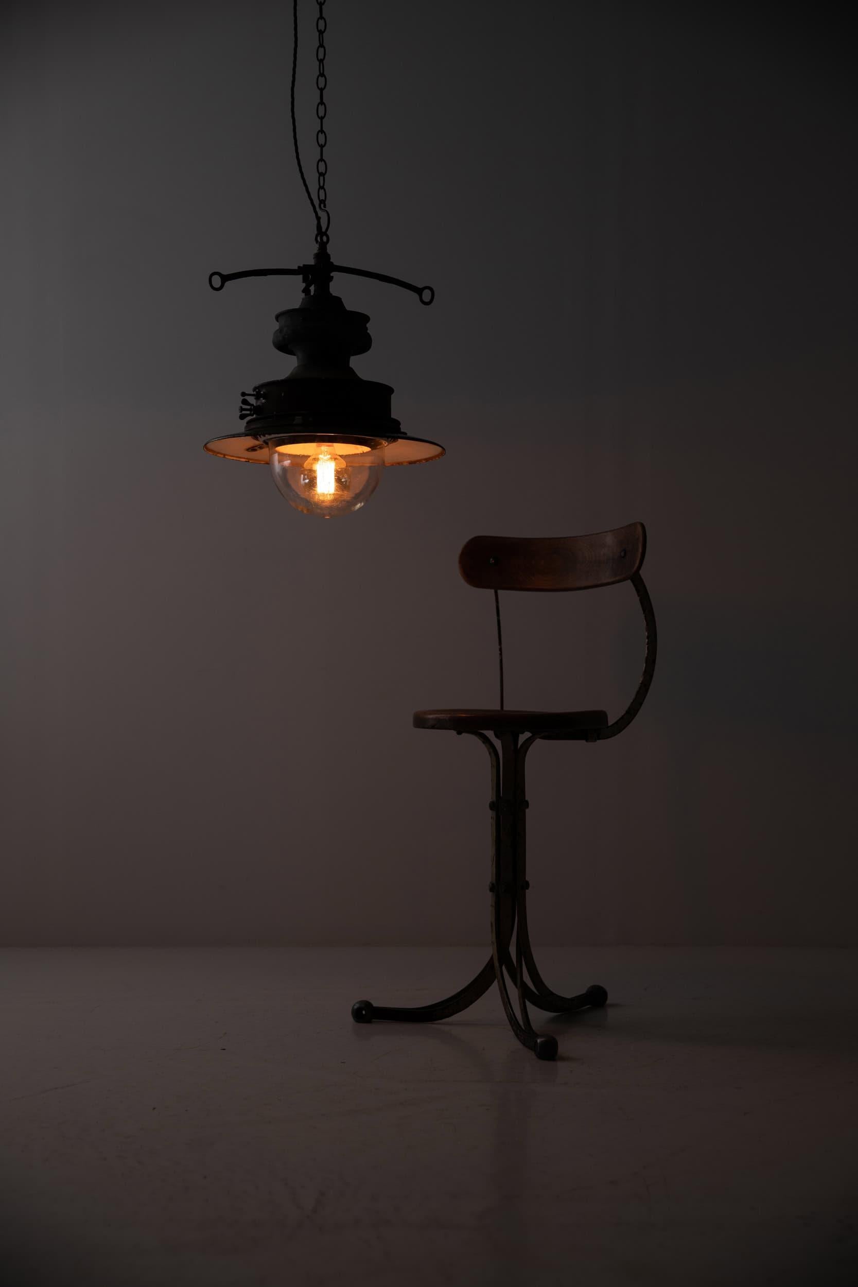 

A beautiful English Victorian copper railway pendant light. c.1890

A former gas lamp often used on railway platforms from the late 19th/early 20th century. 3-tiered copper and enamel metalwork with the original glass hand-blown bowl beneath